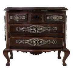 Rosewood jewelry box in the shape of a chest of drawers with silver fittings