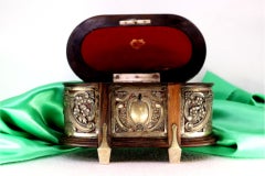 Rosewood jewelry box with silver appliqués around monogram and velvet interior