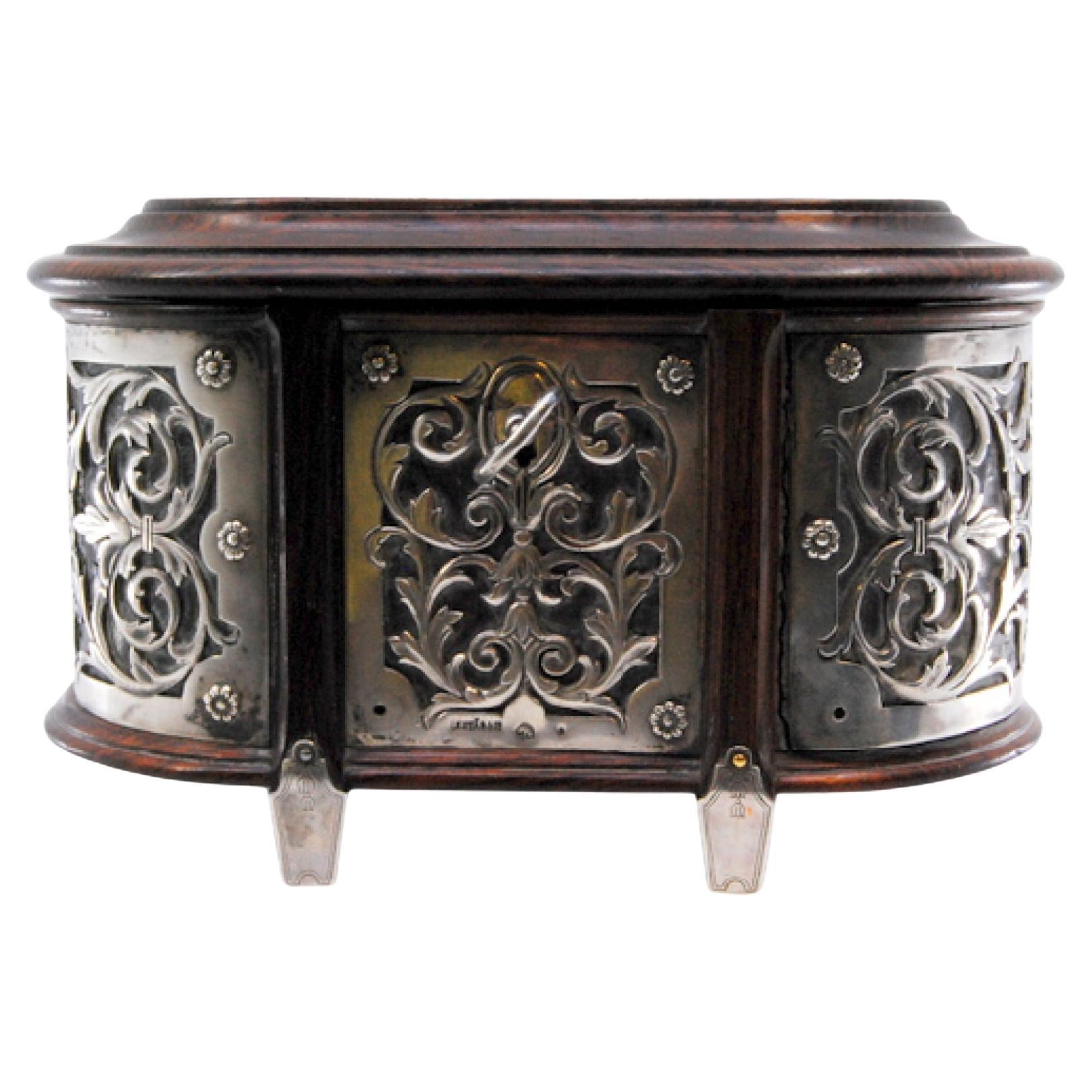 Rosewood jewelry box with silver frame, cut-out garlands, lined interior