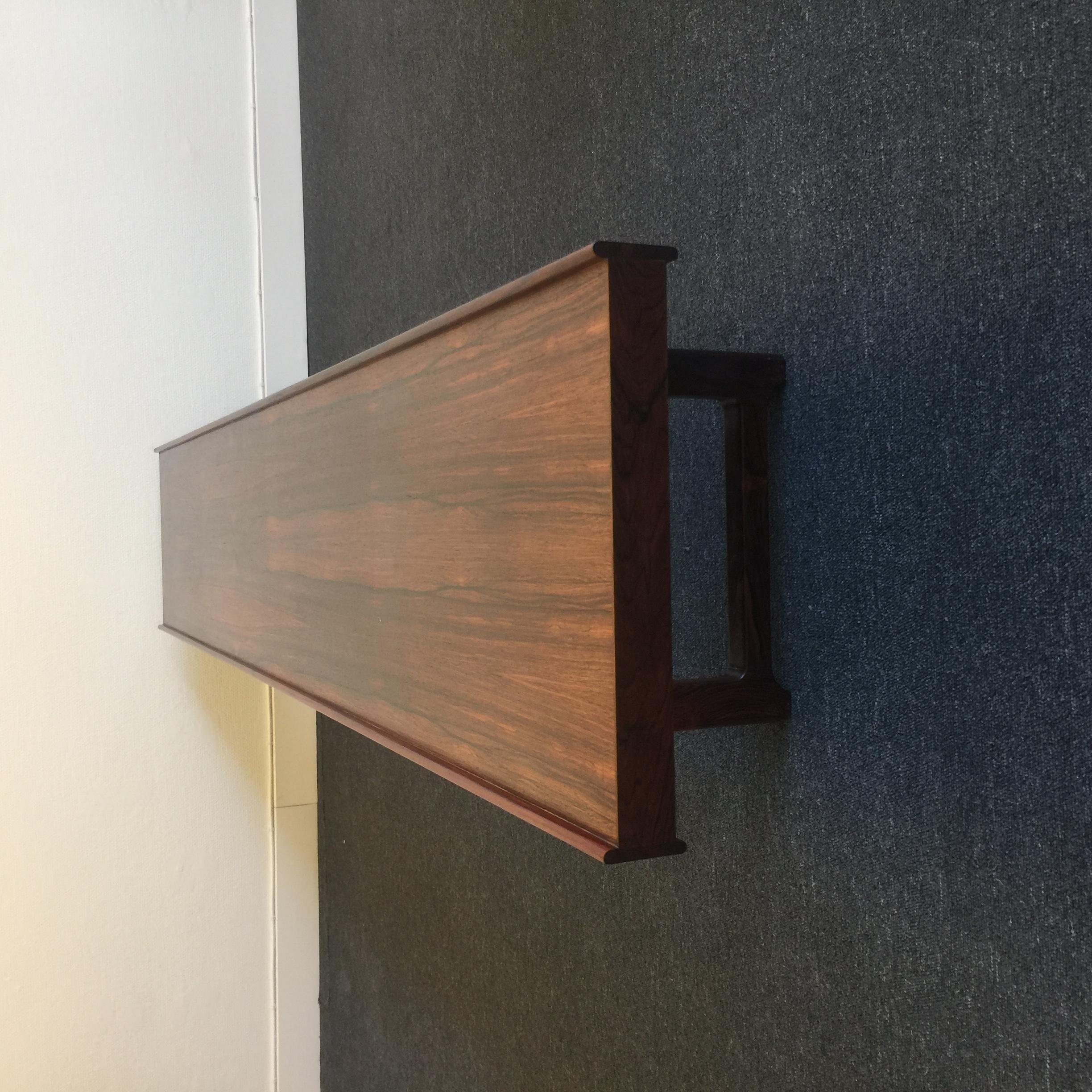 This bench or room divider was designed by Torbjörn Afdal (1917-1999), Norway in 1960. It was manufactured by Mellemstrands trävarefabrik in Krobo. It is made of rosewood. Comes with Cites certificate. Great vintage condition with only minor signs
