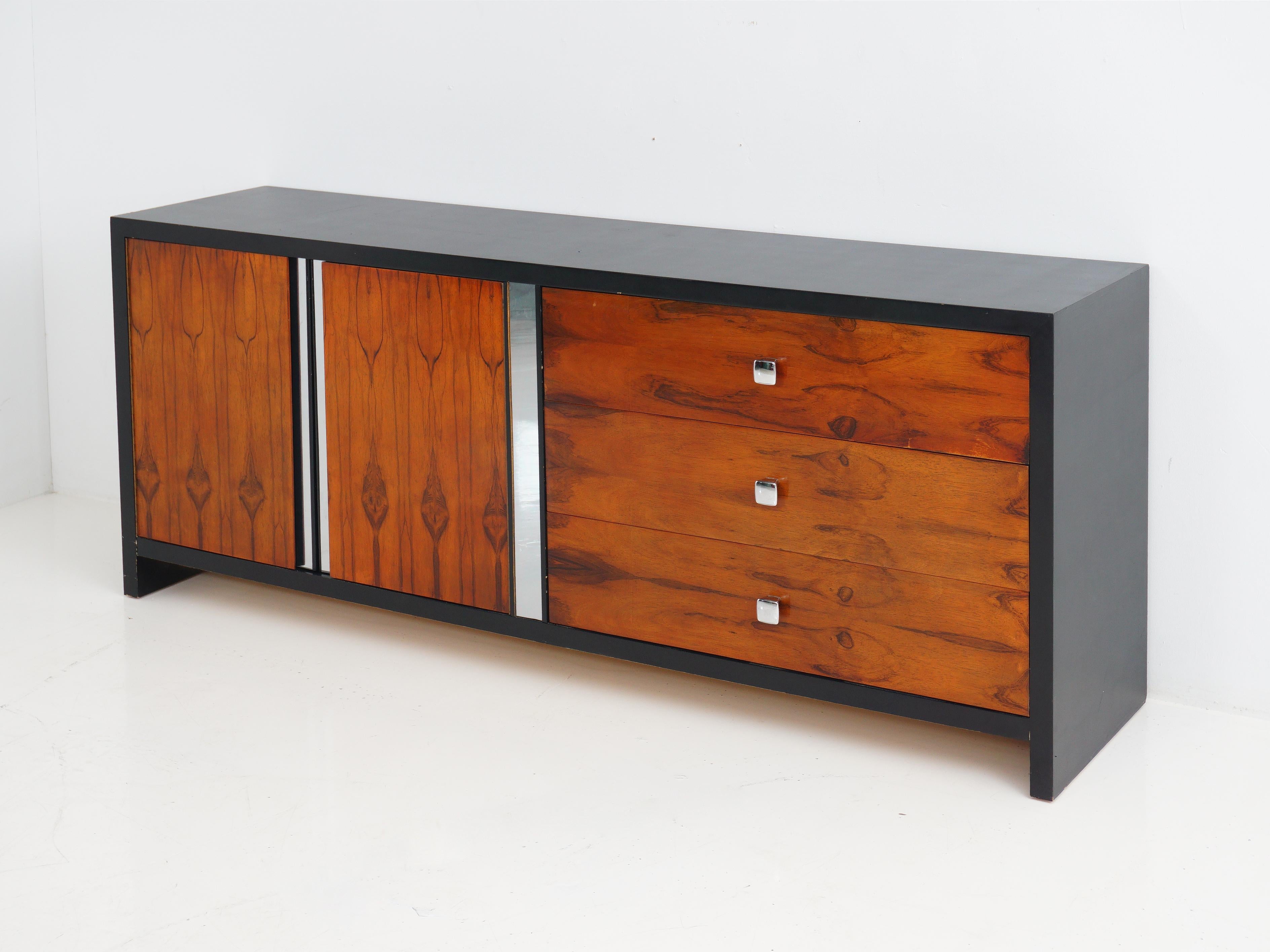 The Mid-Century Modern rosewood front sideboard that's the coolest thing to happen to your dining room since avocado toast. With a sleek black laminate frame and chrome details, it isn't just storage; it's a blast from the past that's here to make