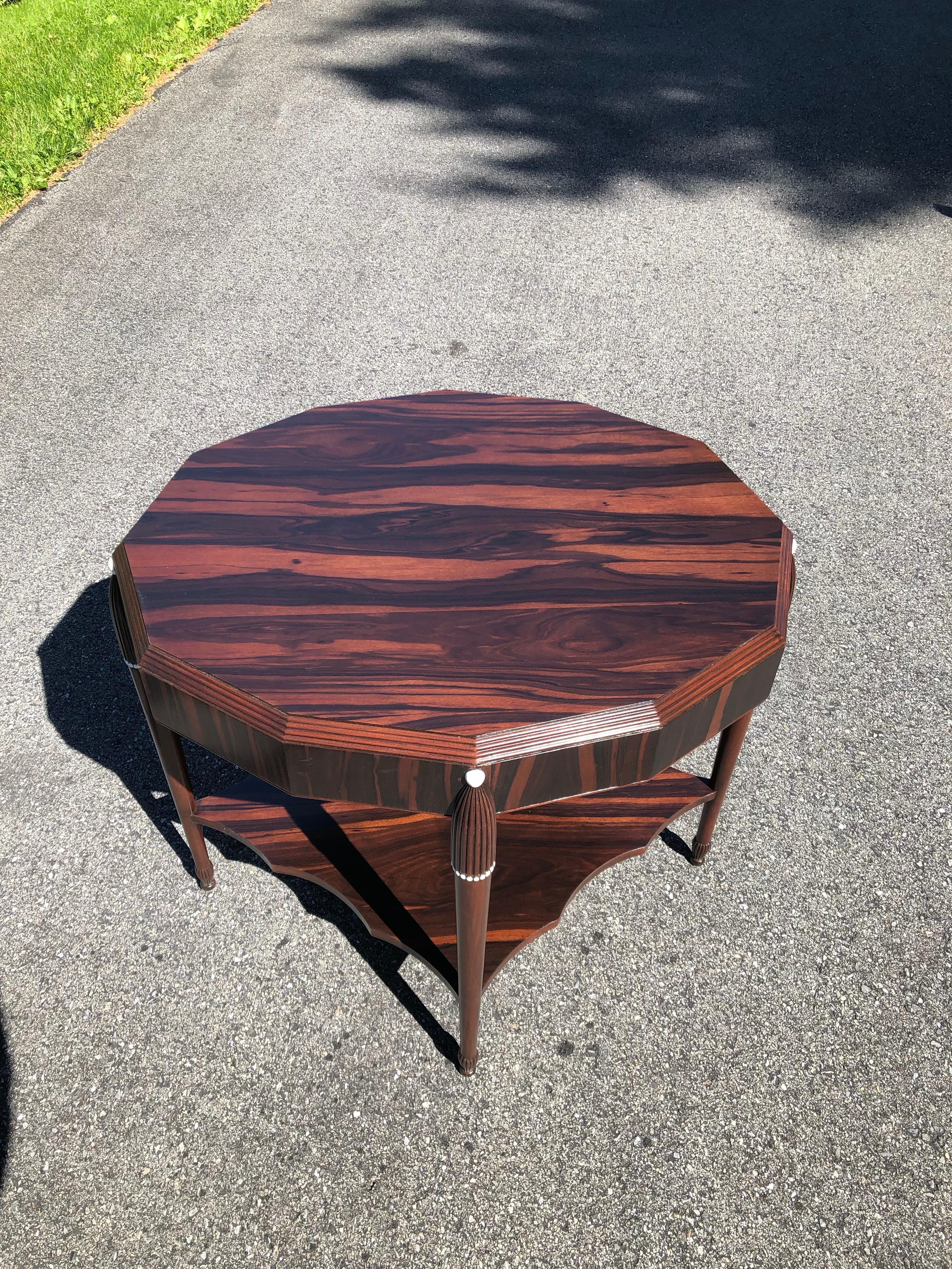 Rosewood late Art Deco center table, France
An extraordinary octagonal rosewood center table with stunning woods.