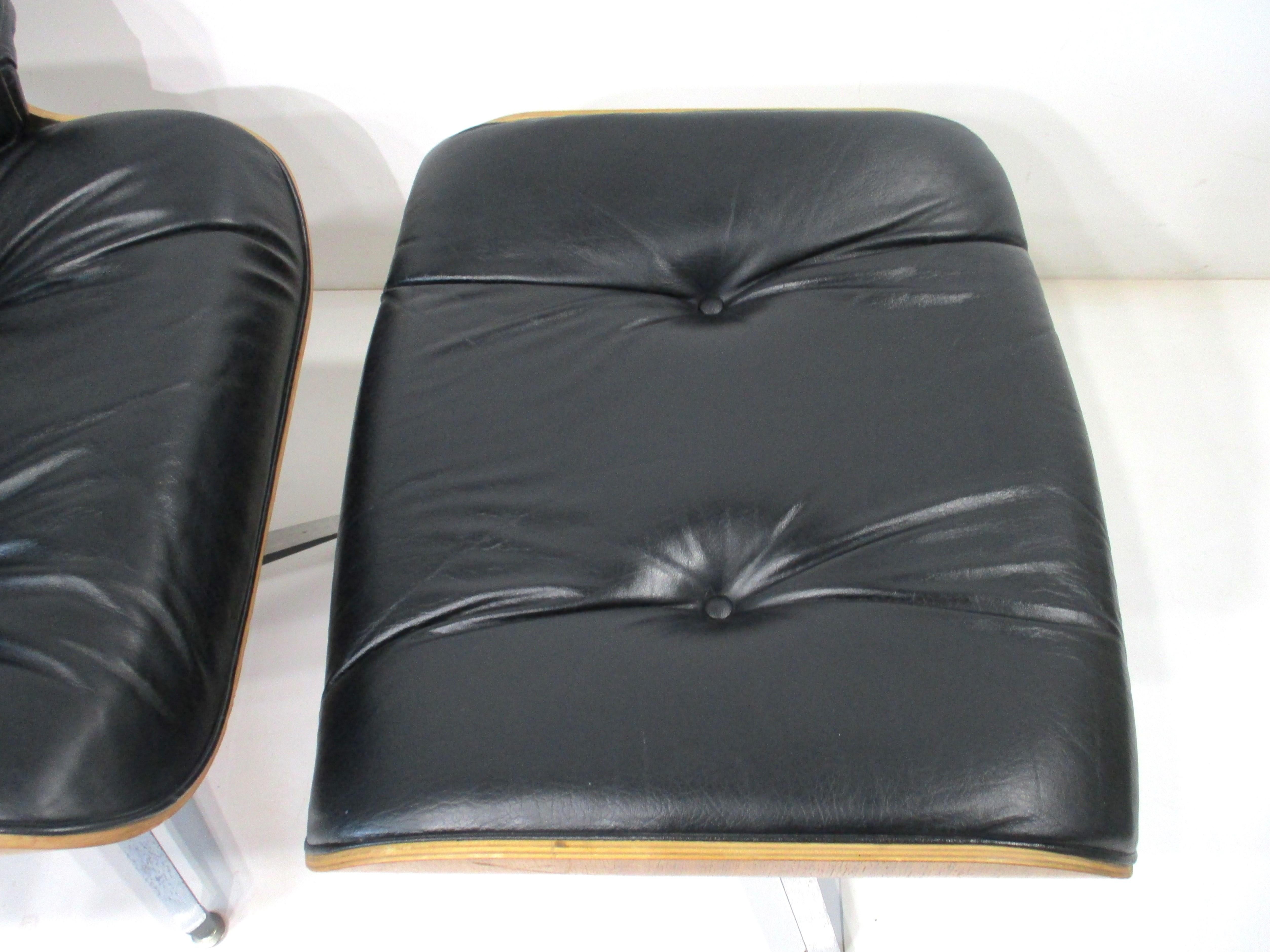 Rosewood Leather Lounge Chair and Ottoman by Plycraft in the style of Eames 1
