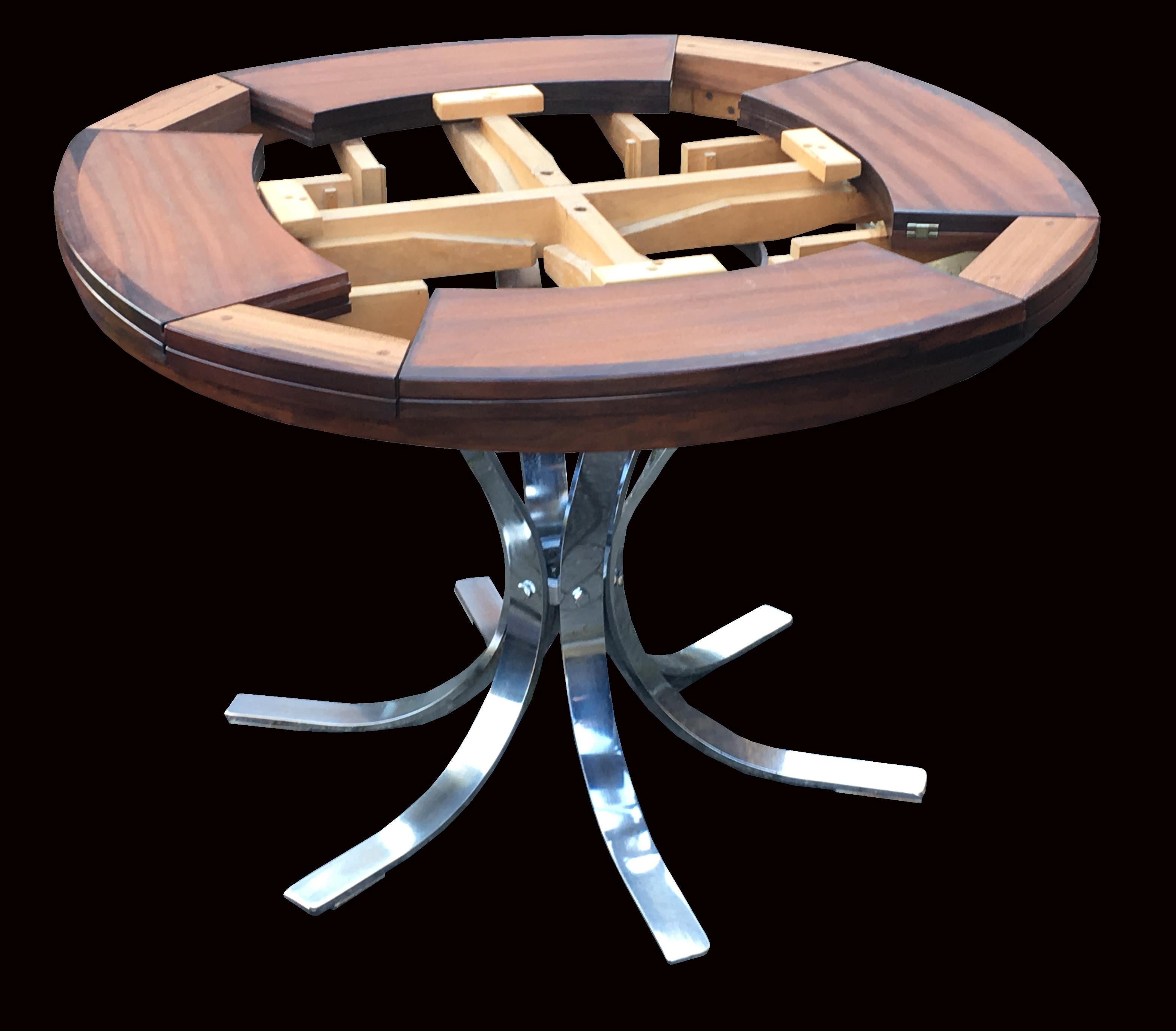 A fine example of this table, being the most sought after in every way, best size (110 cm Diameter closed and 150 cm Diameter open), the best Timber option (Rosewood) and the most practical and good looking base, (the Chrome version) which allows