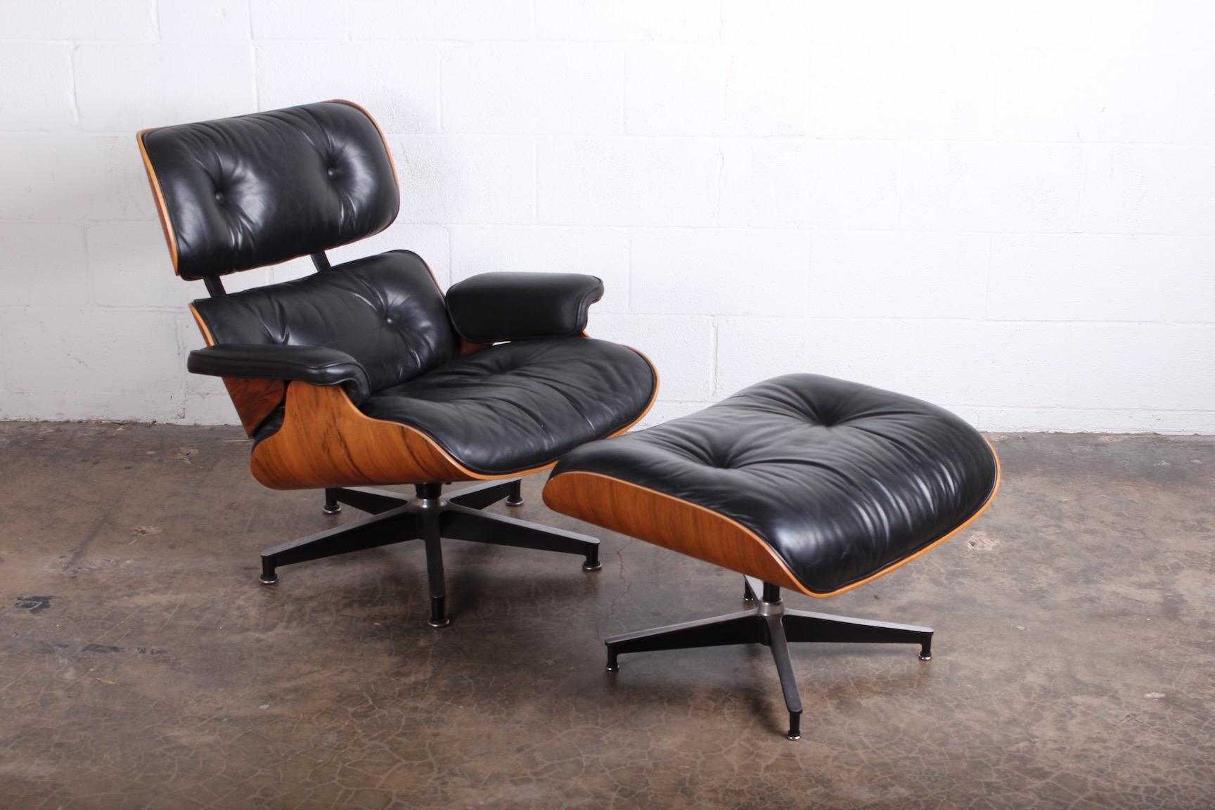 A rosewood 670/671 lounge chair and ottoman by Charles Eames for Herman Miller.