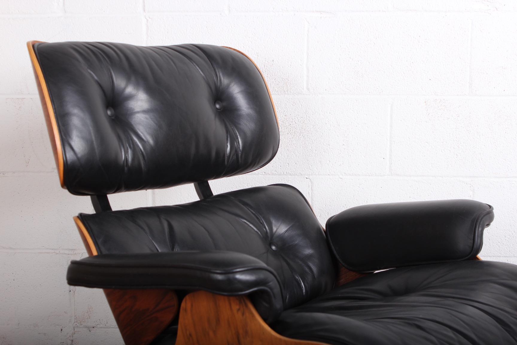 Mid-20th Century Rosewood Lounge Chair and Ottoman by Charles Eames for Herman Miller