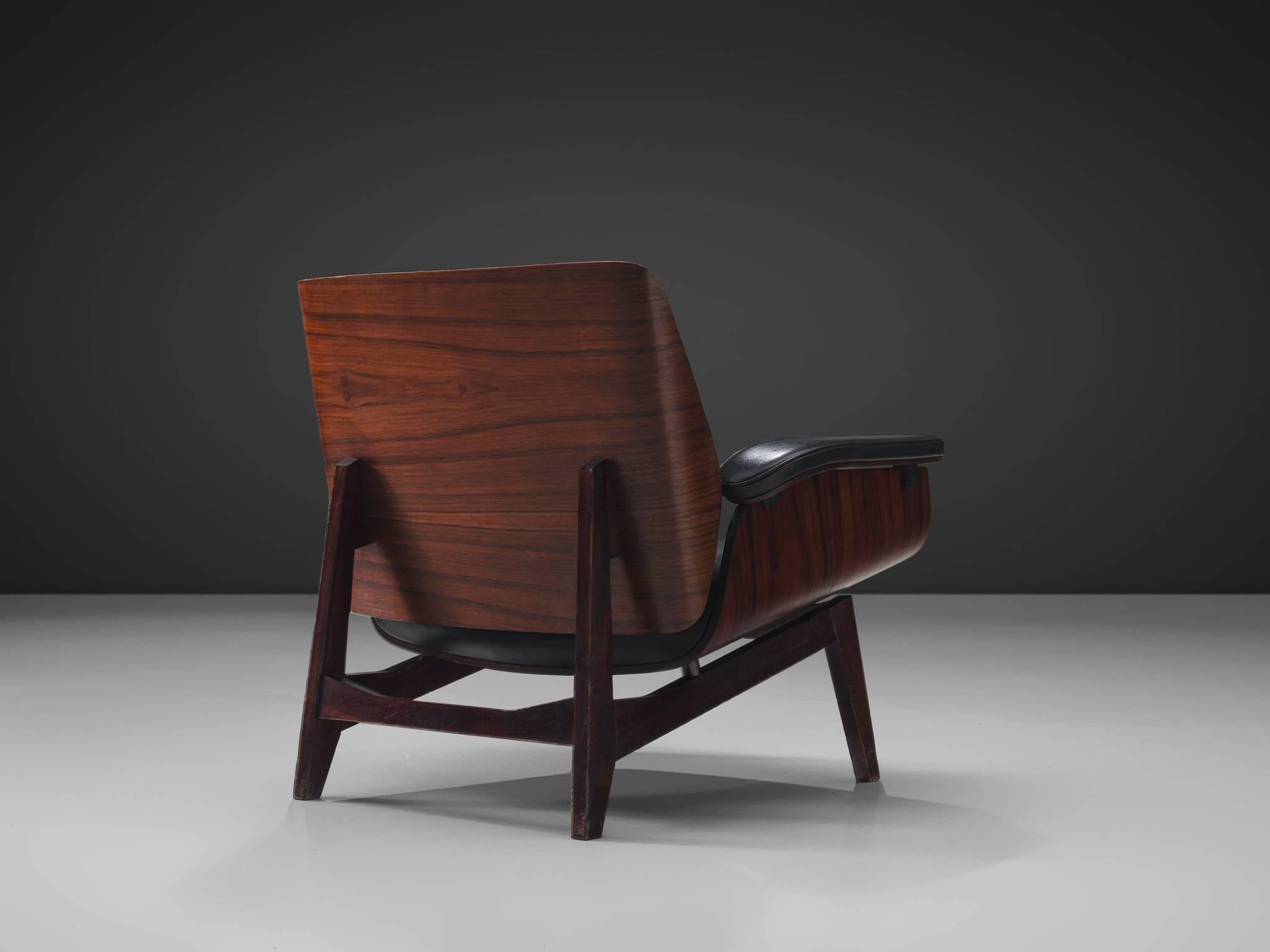 MIM Roma, rosewood, black faux leather, Italy, 1960s. 

Armchair with rosewood frame and orange fabric upholstery. Signature chair by MIM Roma. The seating and back are nicely curved and mirrored to each other. Nicely designed legs with folded