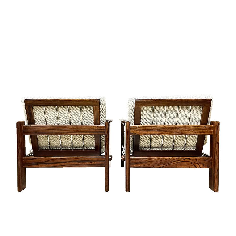 A pair of extremely rare armchairs designed by Dutch designer Rob Parry, with a very elegant shape with a combination of rosewood, chrome metal and a seat, as if suspended in this structure. This gives them both a modern and warm air; we redid the