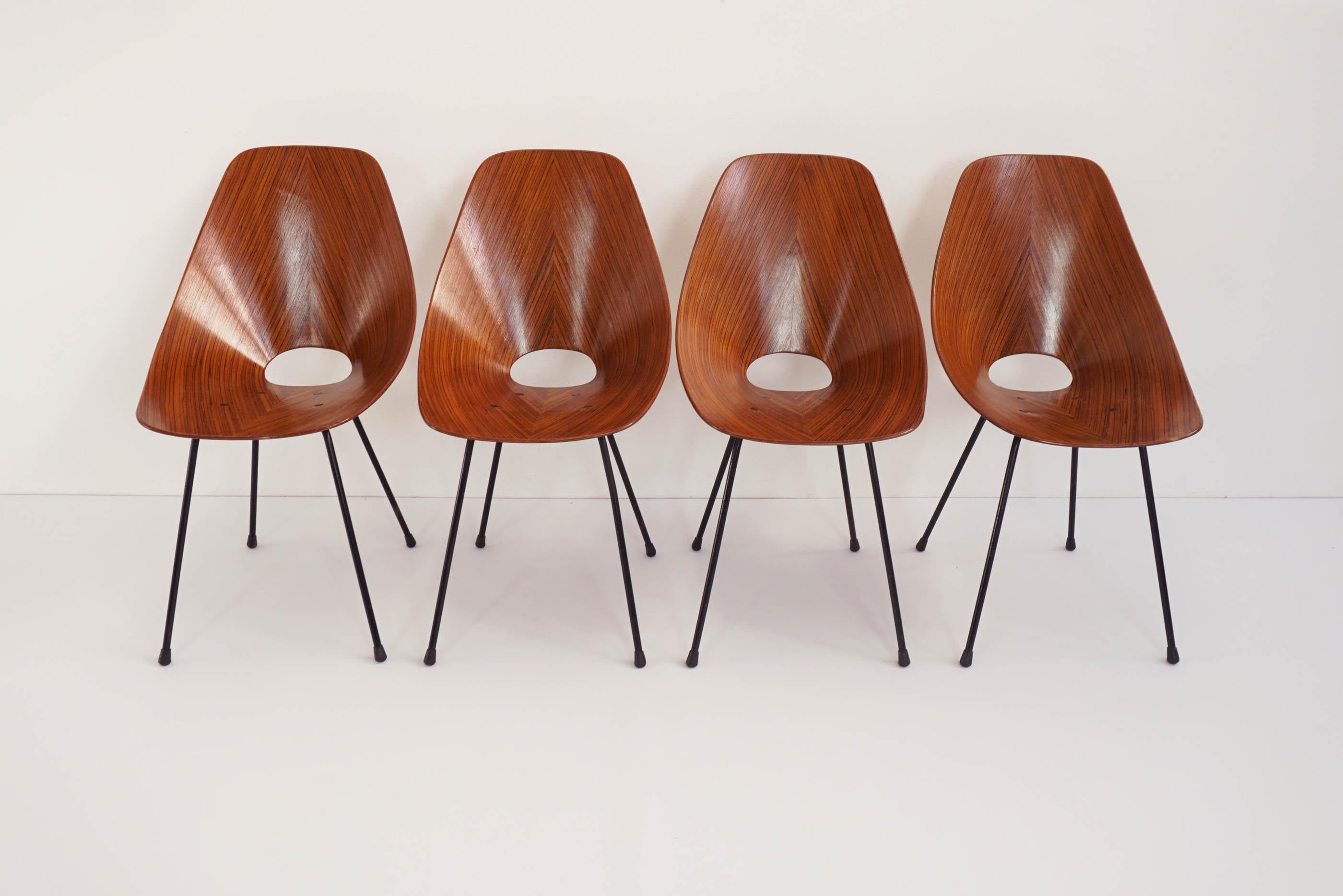 Set of 4 iconic Medea chairs in beautiful rosewood.