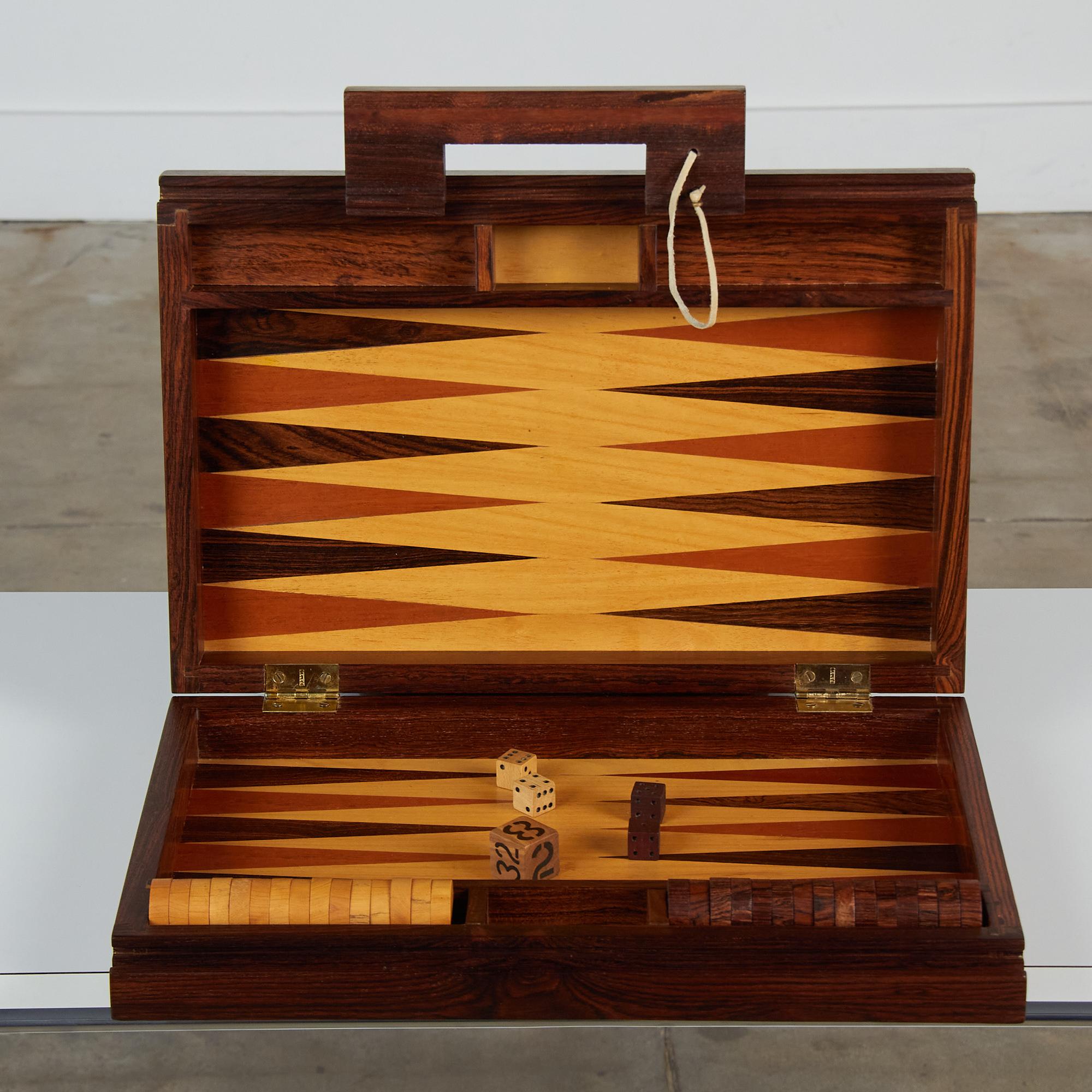 A modernist backgammon set by US-born, Mexico-based designer Don Shoemaker for his company Señal. This portable set includes the game board, which folds up into a carrying case, checkers, rolling dice, and doubling dice. Made from local hardwood