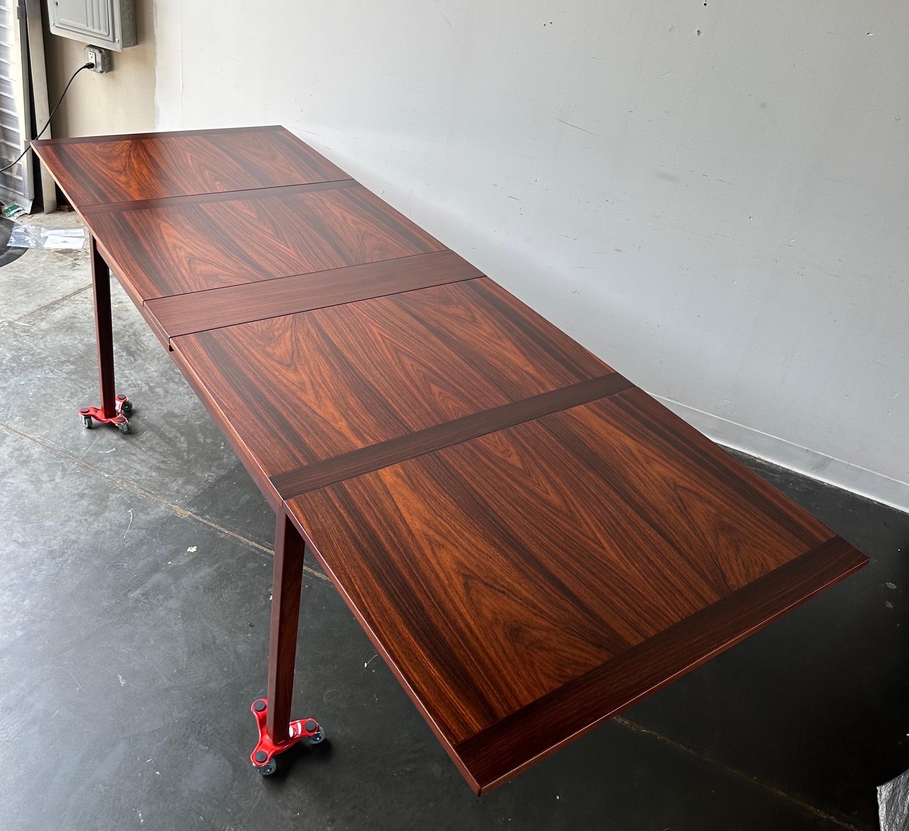 Professionally refinished stunning rosewood flip top dining table by Skaraborgs Sweden circa 1960.

Gorgeous table that extends from 54” to 102” flip a simple flip ( see video )