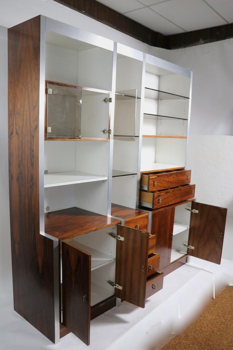 20th Century Rosewood Metal Glass and Formica Wall Unit Baugnman Attributed for John Stuart For Sale