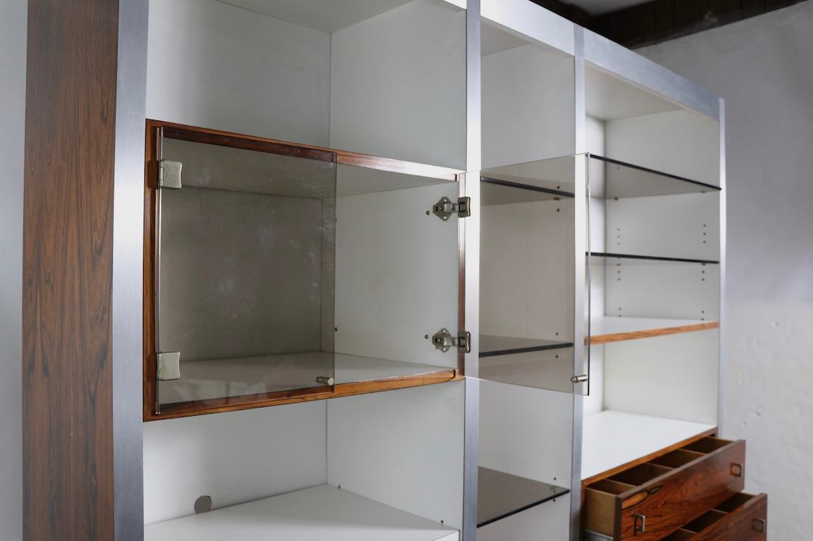 Rosewood Metal Glass and Formica Wall Unit Baugnman Attributed for John Stuart For Sale 1