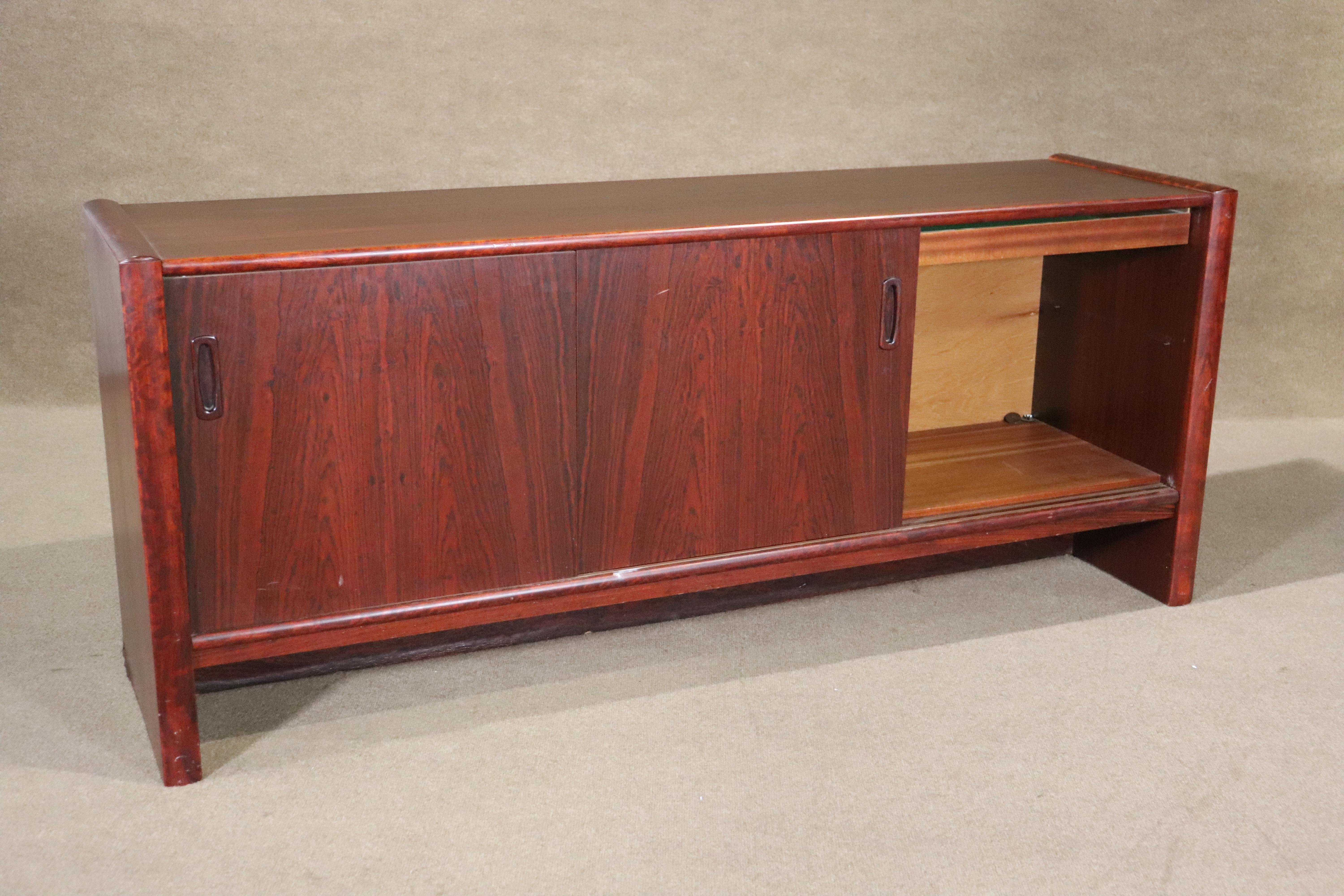 Long mid-century modern credenza with sliding doors. Open cabinet storage with shelf capability.
Please confirm location NY or NJ