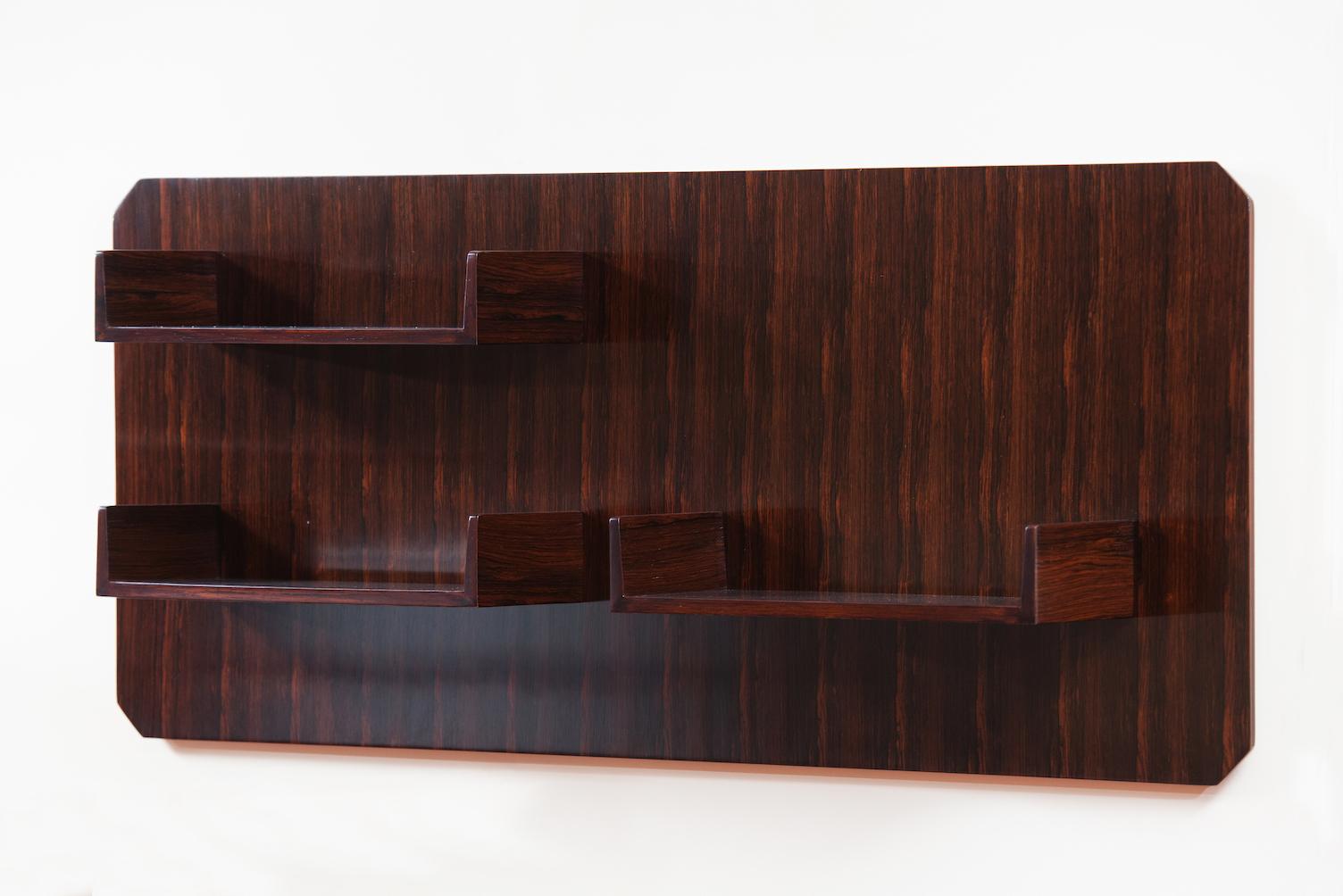 Rosewood Mid-Century Modern suspended shelf.