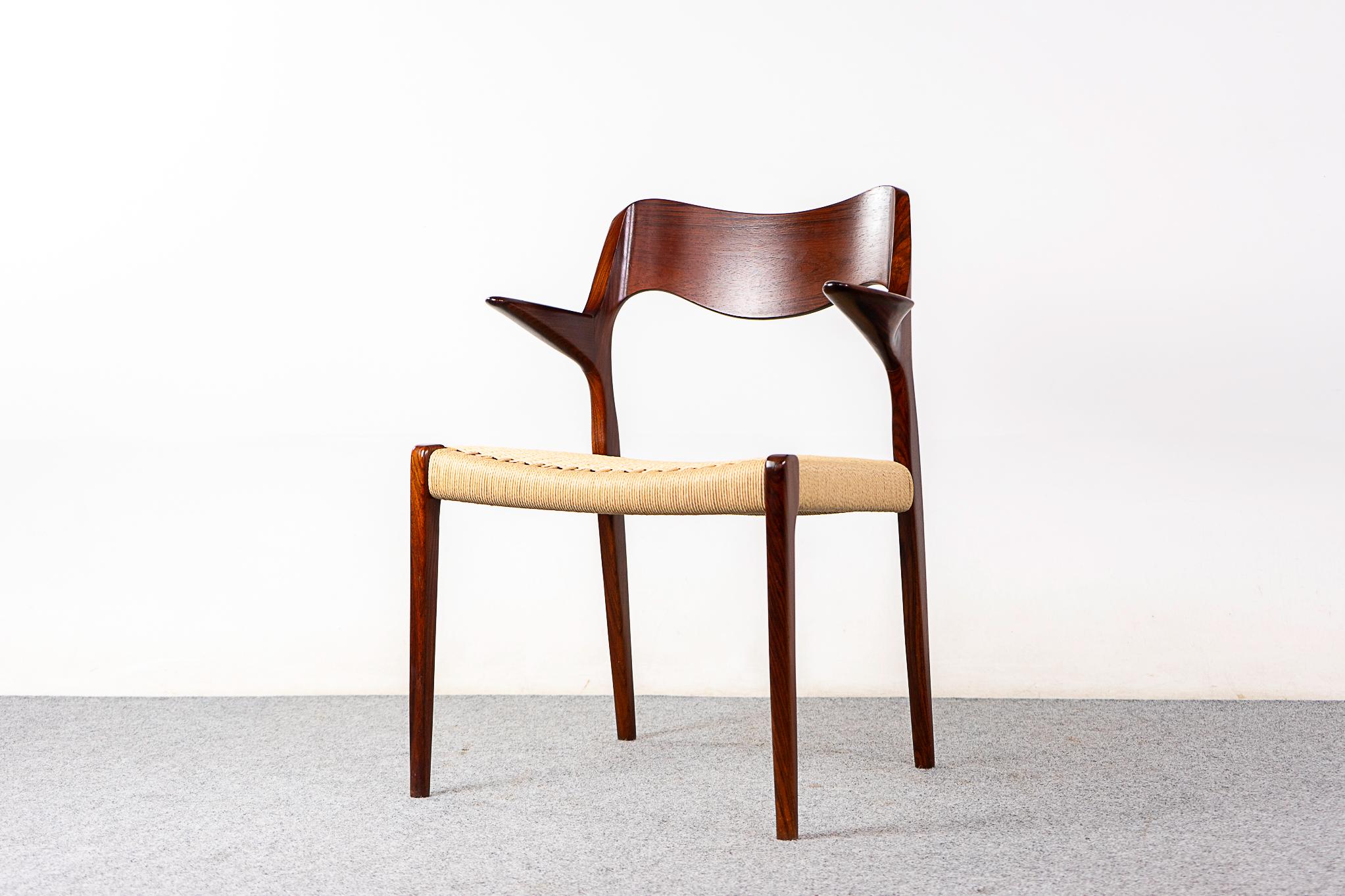 Rosewood model 55 armchair by Niels Otto Moller for J L Moller Mobelfabrik, circa 1950's. Iconic frame with graceful lines, sculptural floating armrests and a new meticulously woven paper cord seat. JL Moller maker's mark intact. 

Please inquire
