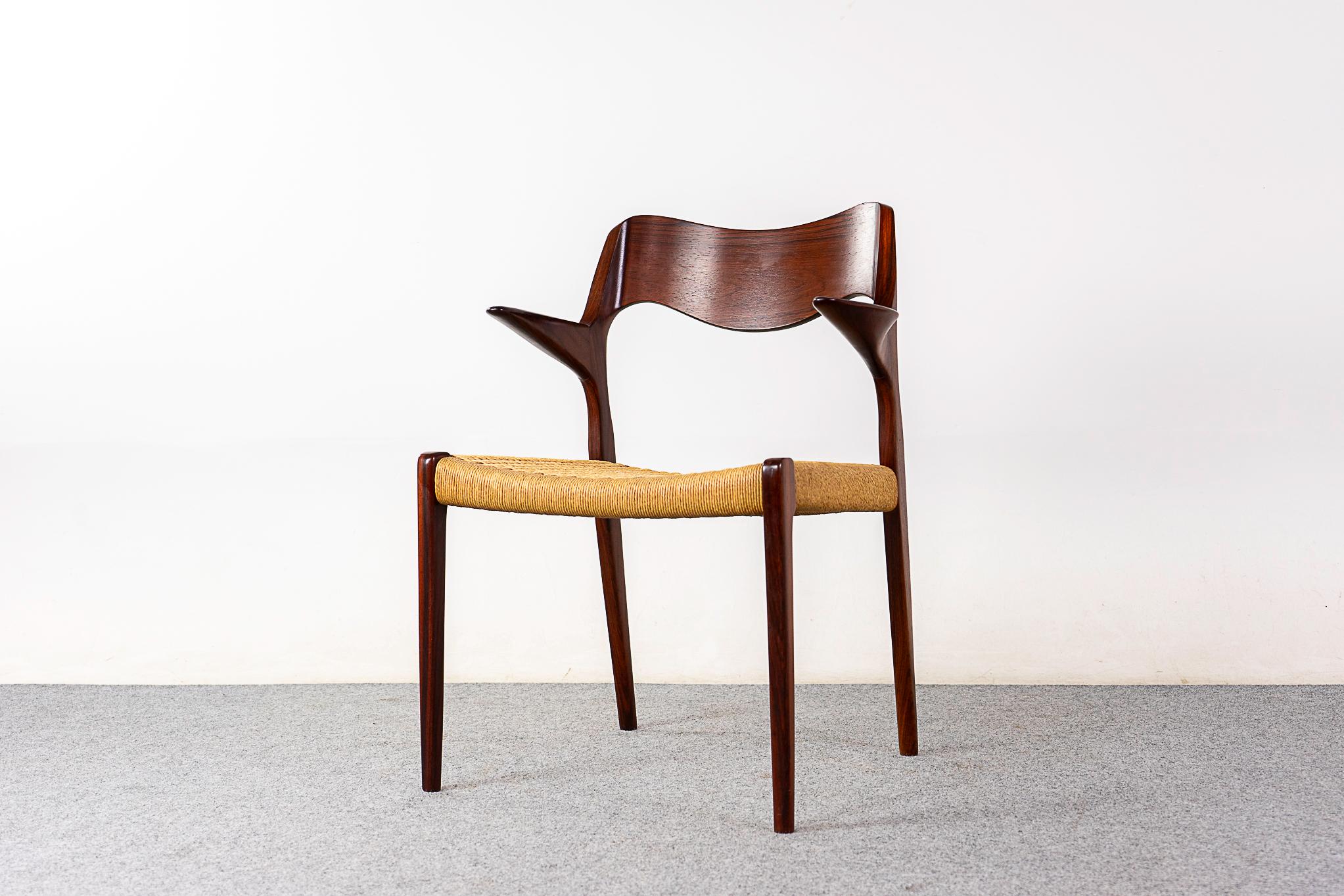 Rosewood model 55 armchair by Niels Otto Moller for J L Moller Mobelfabrik, circa 1950's. Iconic frame with graceful lines, sculptural floating armrests and a meticulously woven paper cord seat. JL Moller maker's mark intact. 

Please inquire for