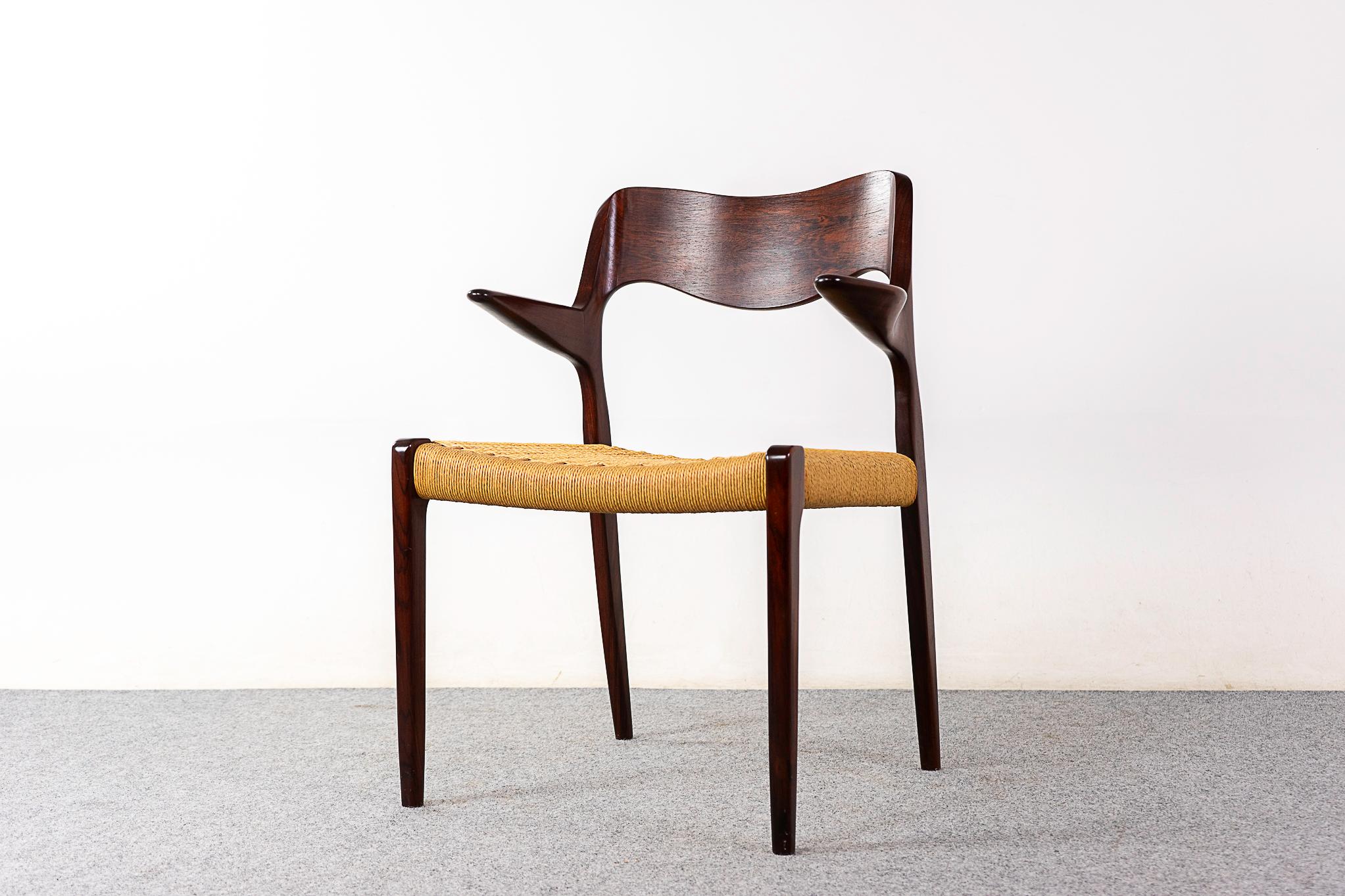 Rosewood model 55 armchair by Niels Otto Moller for J L Moller Mobelfabrik, circa 1950's. Iconic frame with graceful lines, sculptural floating armrests and a meticulously woven paper cord seat. JL Moller maker's mark intact. 

Please inquire for