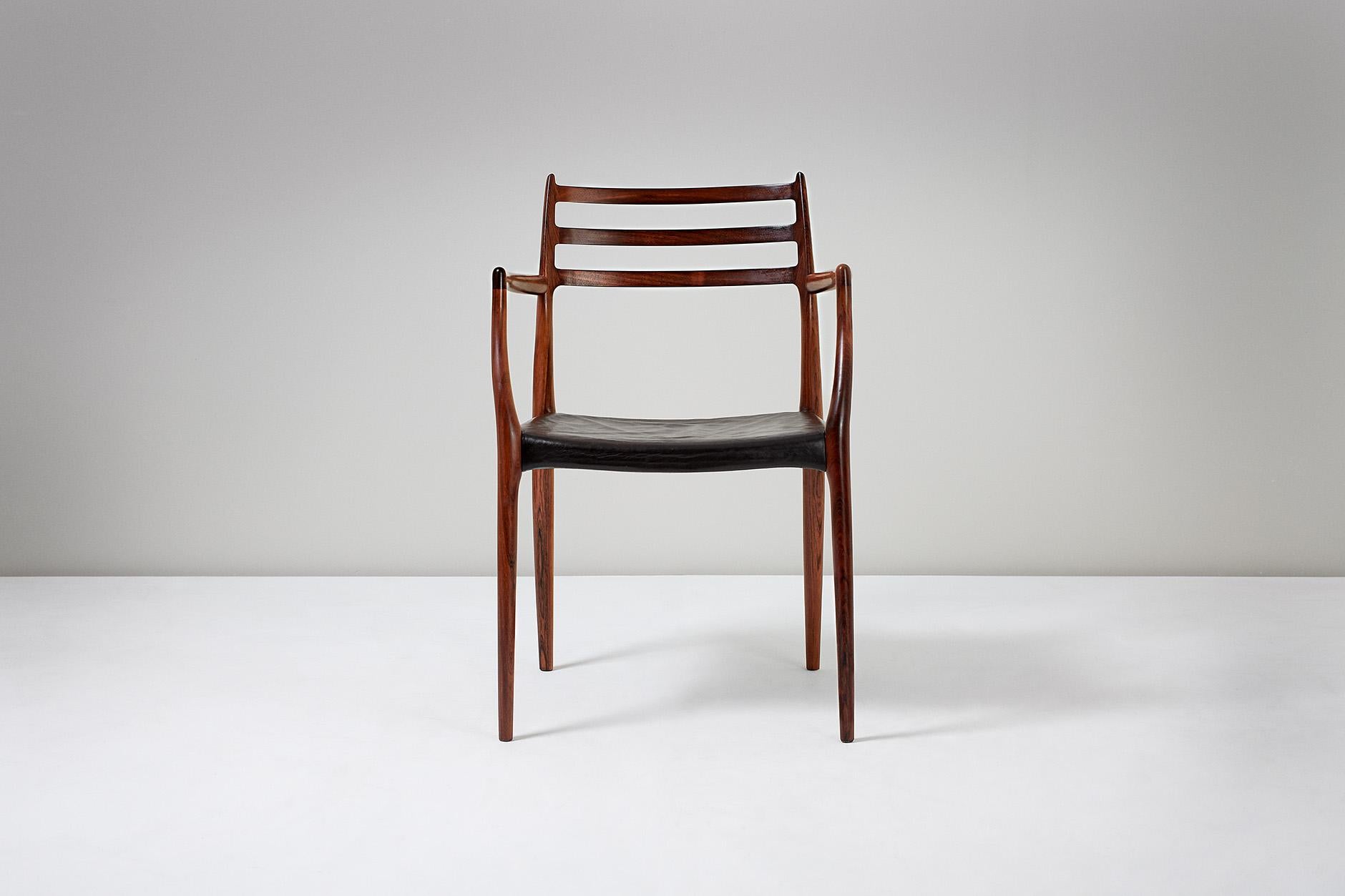 Niels Møller

Model 62 Armchair, 1962

Rosewood armchair designed by Niels Moller for J.L. Moller Mobelfabrik, Denmark, 1962. Original, patinated leather seat. 

Dimensions: H 80cm, D 55cm, W 56cm.

