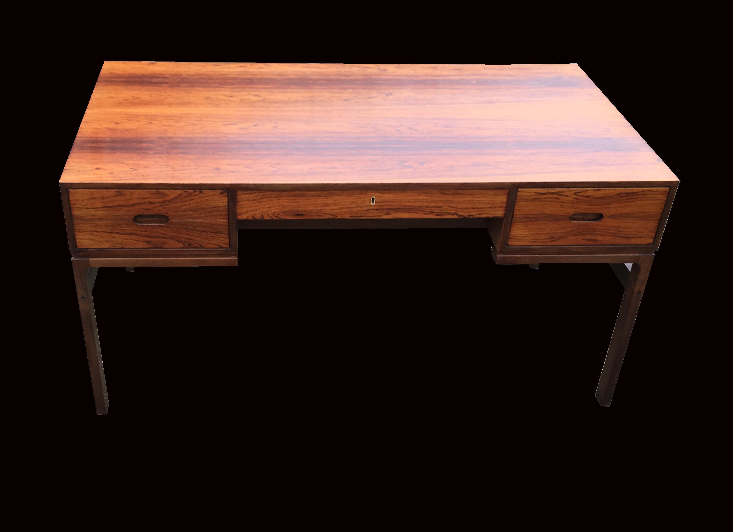 This scarce and beautiful desk was designed in the 1960s by Arne Wahl Iversen and produced in the same decade in rosewood by Vinde Mobelfabrik. It is in very good original condition.