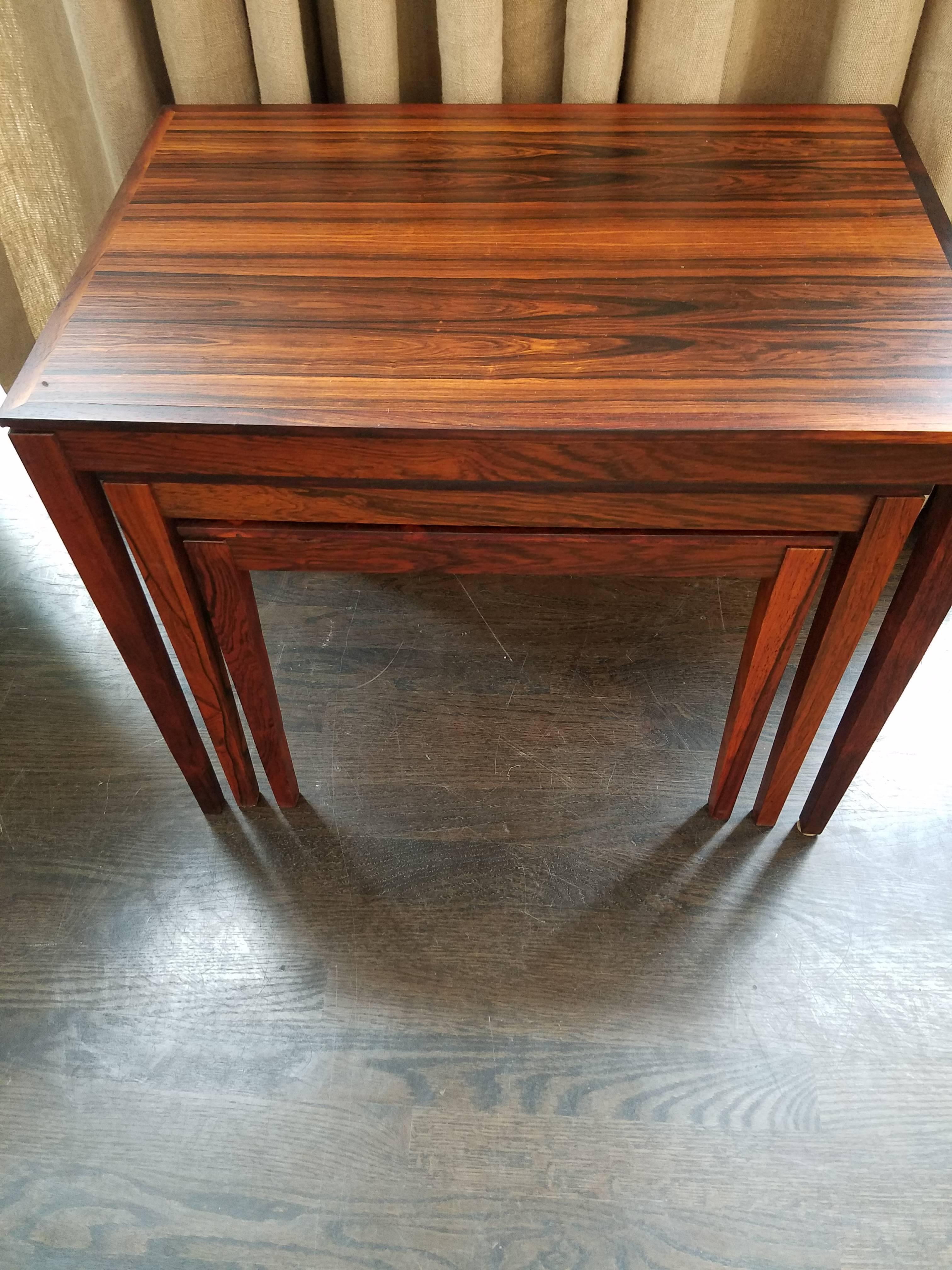 Original Bent Silberg Mobler 1970s Danish set of three nesting tables. These rosewood tables feature tapered legs with reveal around tops. All three tables are in excellent condition.

Measurements: 23.5