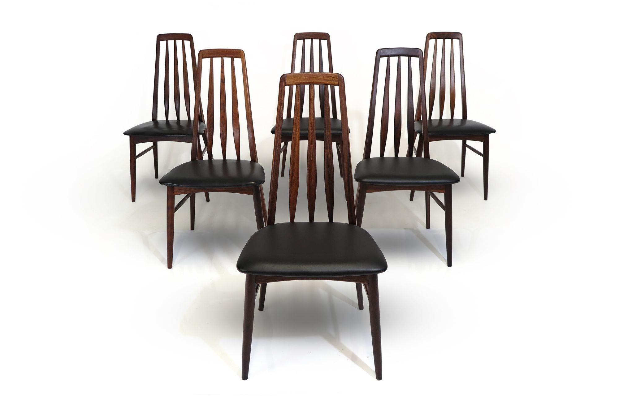 Six rosewood dining chairs designed by Niels Koefoed for Koefoeds Hornslet, 1962 Denmark. The chair frames are crafted of solid rosewood with angled, slatted back rests, which offers comfortable lumbar support. The upholstered seats are in the