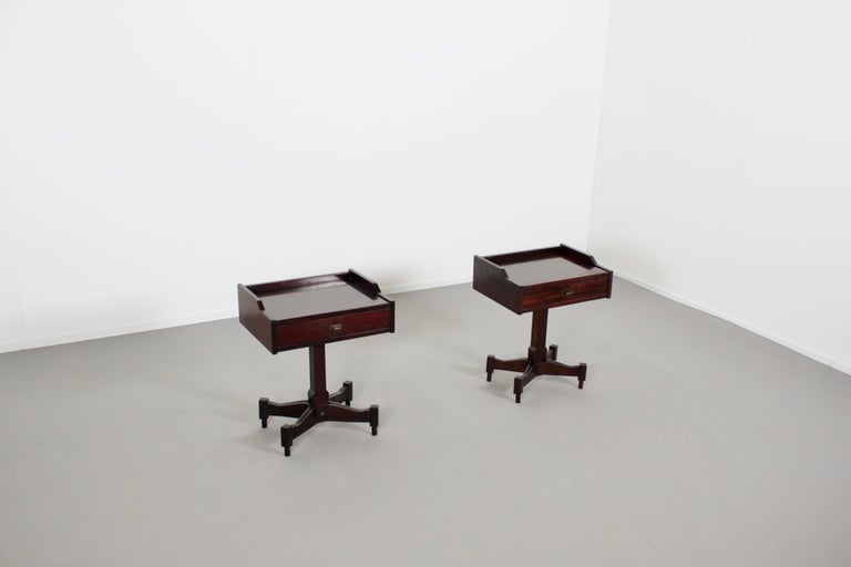 Beautiful set of SC-50 occasional tables in very good condition.

Designed by Claudio Salocchi in the 1960s 

Produced by Sormani, Italy 

Made of beautiful dark rosewood.

The tables feature brass pulls and feet, and a single drawer that sits on