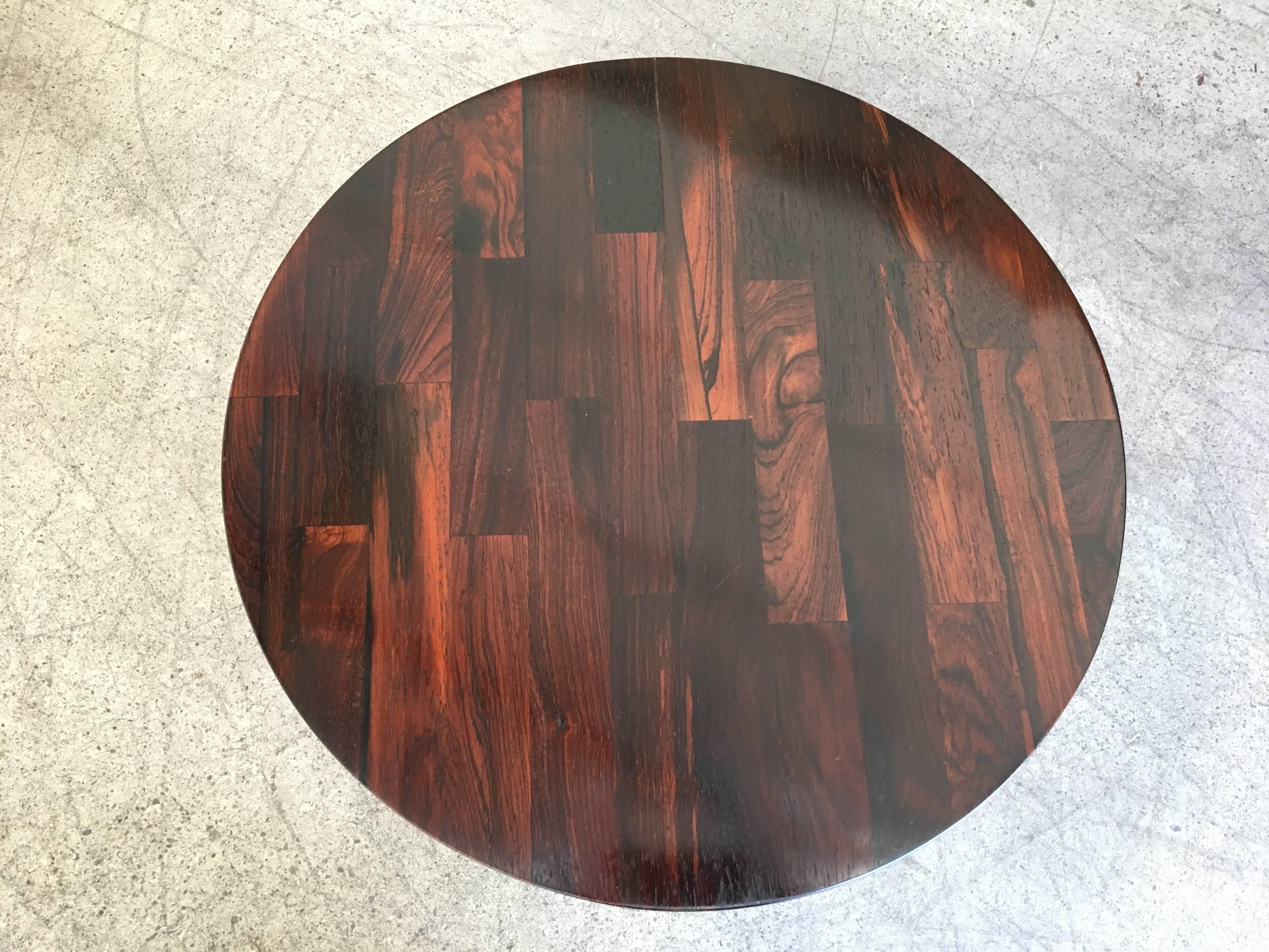 This is solid rosewood strips that were assembled into a round top for the chrome X-base.