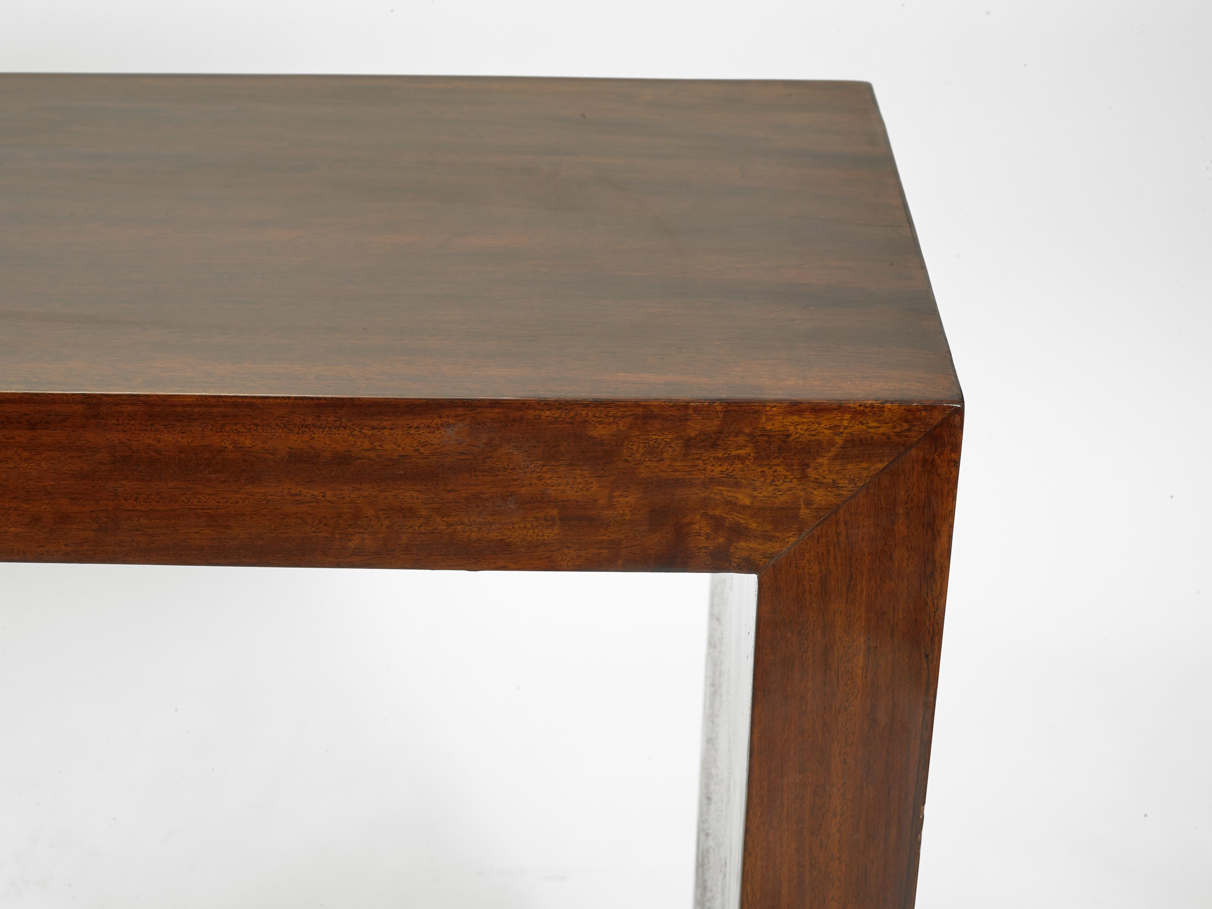 Offered is a solid Rosewood Mid 20th Century Parsons-style console table, one of a pair available. 

It weighs approximately 250 lbs. and they each measure 60.25