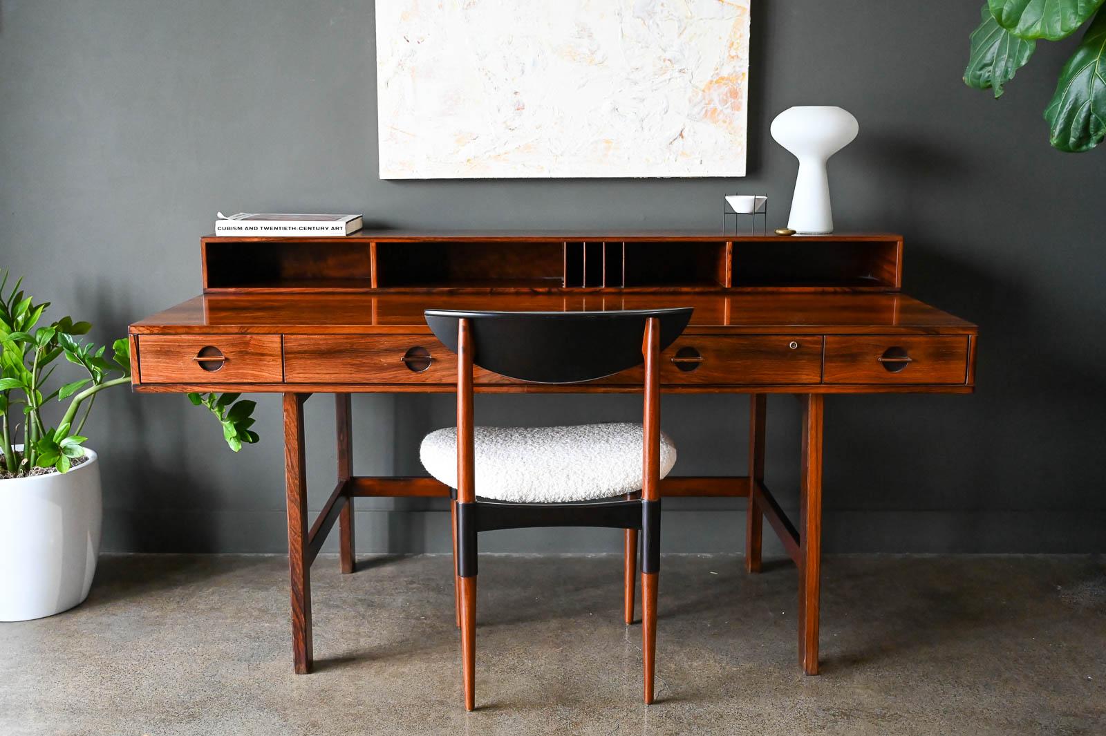 Rosewood Partners Desk by Peter Lovig Nielsen, 1969. Gorgeous rosewood grain and all original brass hardware, this desk allows a flip down side and can be used as a partners desk as well as a larger single desk. Multiple storage compartments and all