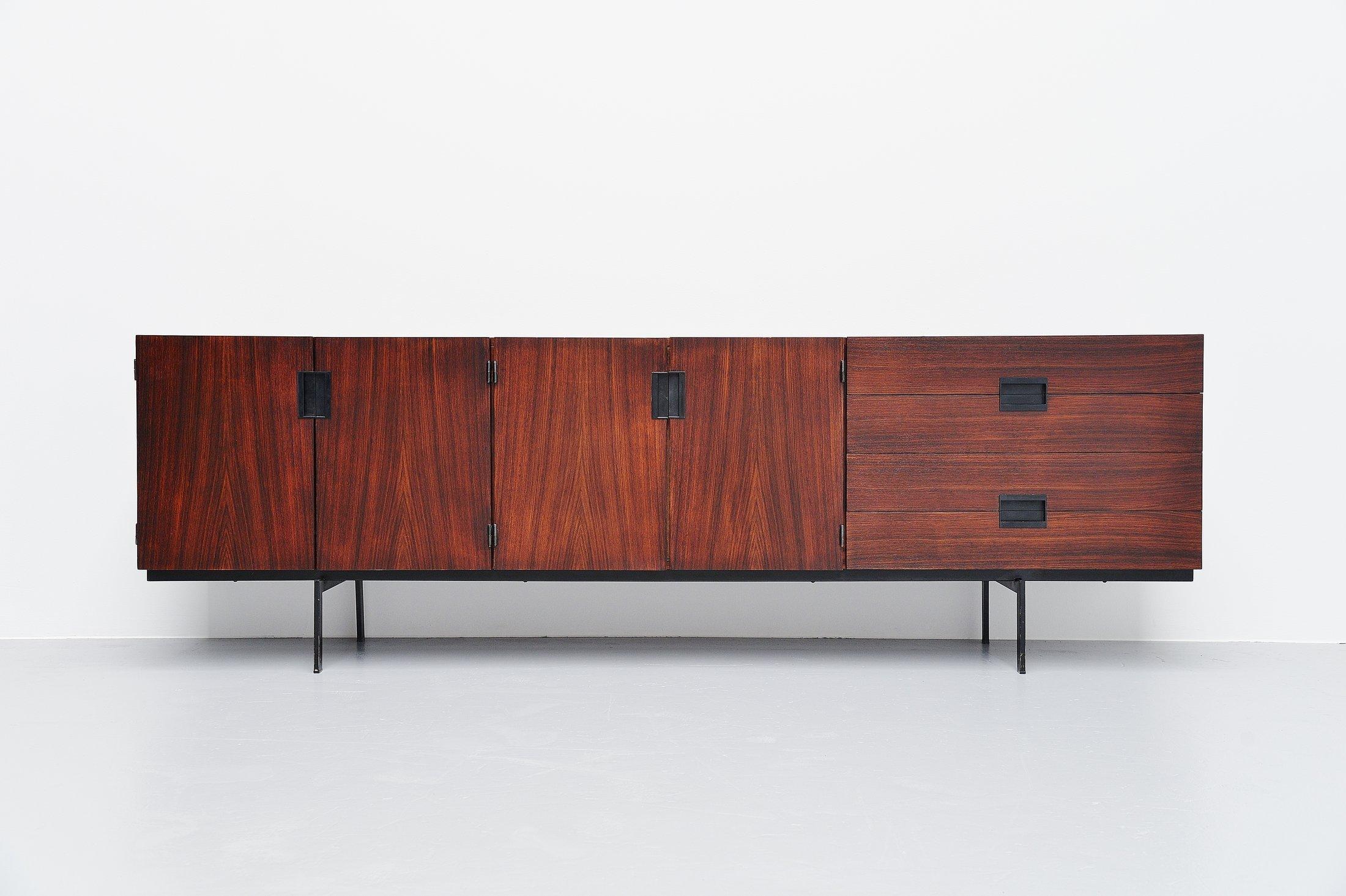 This is for a super rare custom made sideboard model DU03, designed by Cees Braakman and manufactured by Pastoe UMS, Holland, 1958. This unique sideboard is made of rosewood and has a black lacquered metal frame. The Japanese series by Pastoe could