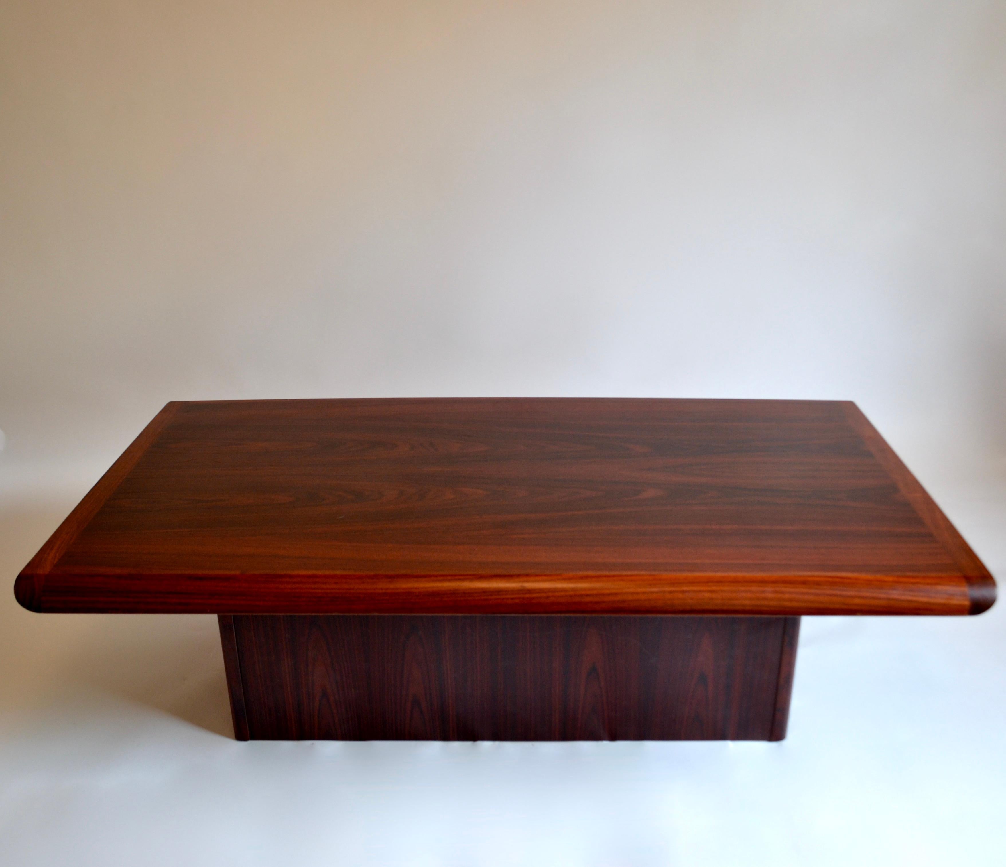 1960s rosewood pedestal coffee table of a rectangular shape designed and made in Denmark by Vejle Stole & Møbelfabrik. Makers stamp on underside of table.