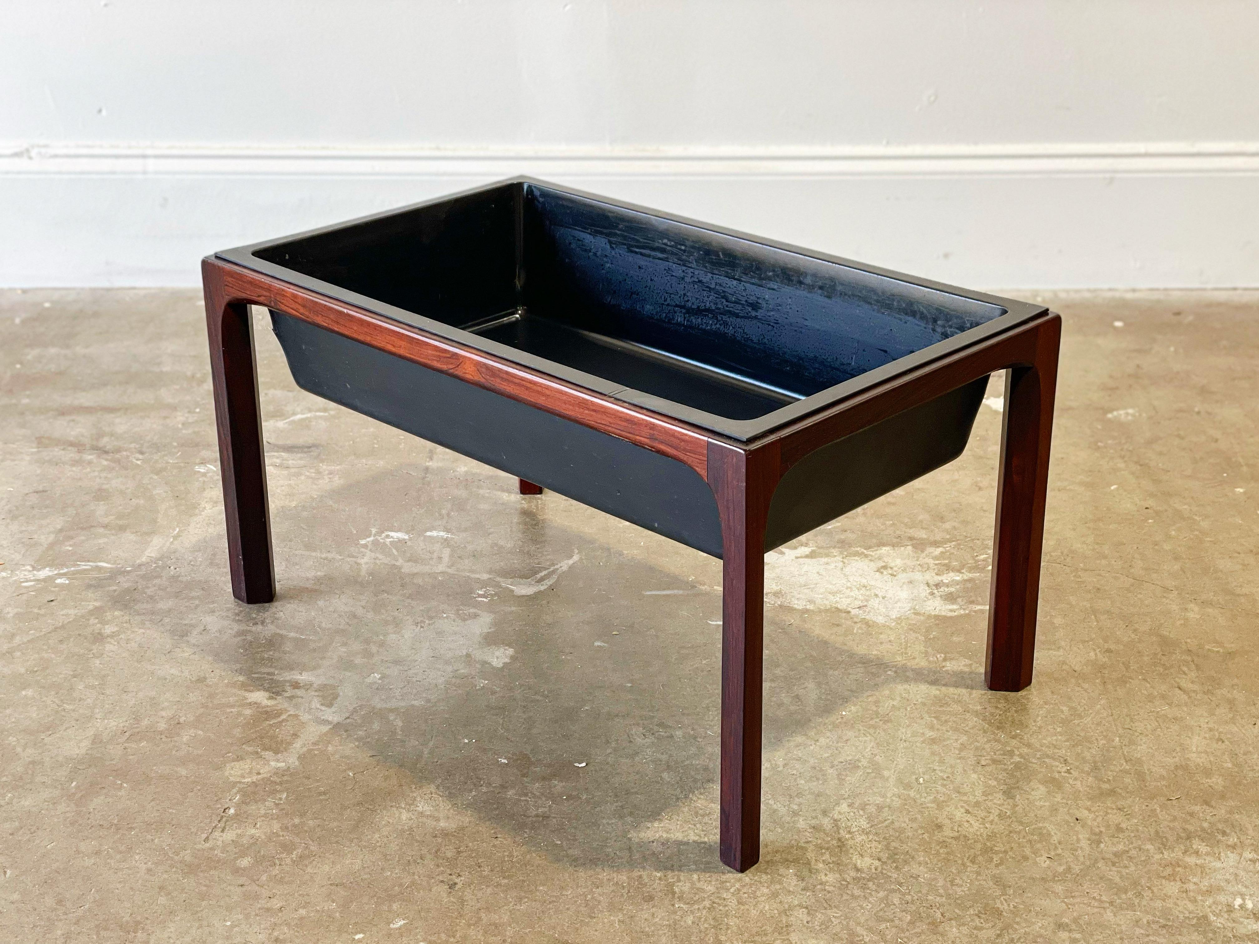 Rare rosewood planter designed by Aksel Kjersgaard for Vinde Mobelfabrik, Denmark circa 1960s. Clean modern lines featuring Kjersgaard's signature chamfered legs. Intended for indoor use. Rosewood frame is in excellent condition and displays