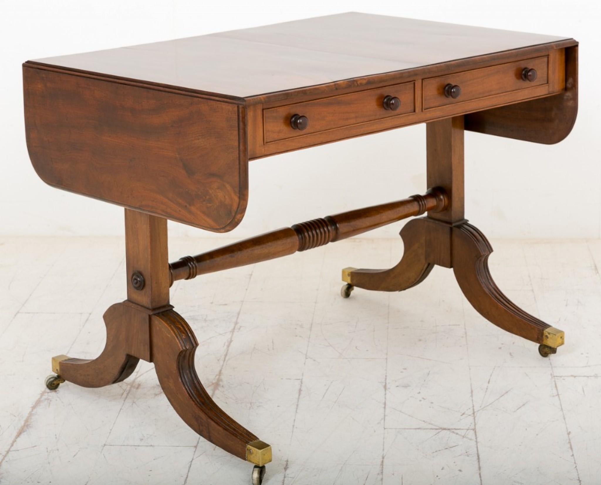 A superb Quality Rosewood Sofa Table.
Standing on cast brass castors with a swept leg with carved knees and ring turned supports.
This piece features 2 x Mahogany lined working drawers with 2 x faux drawers to the reverse.
The top being veneered