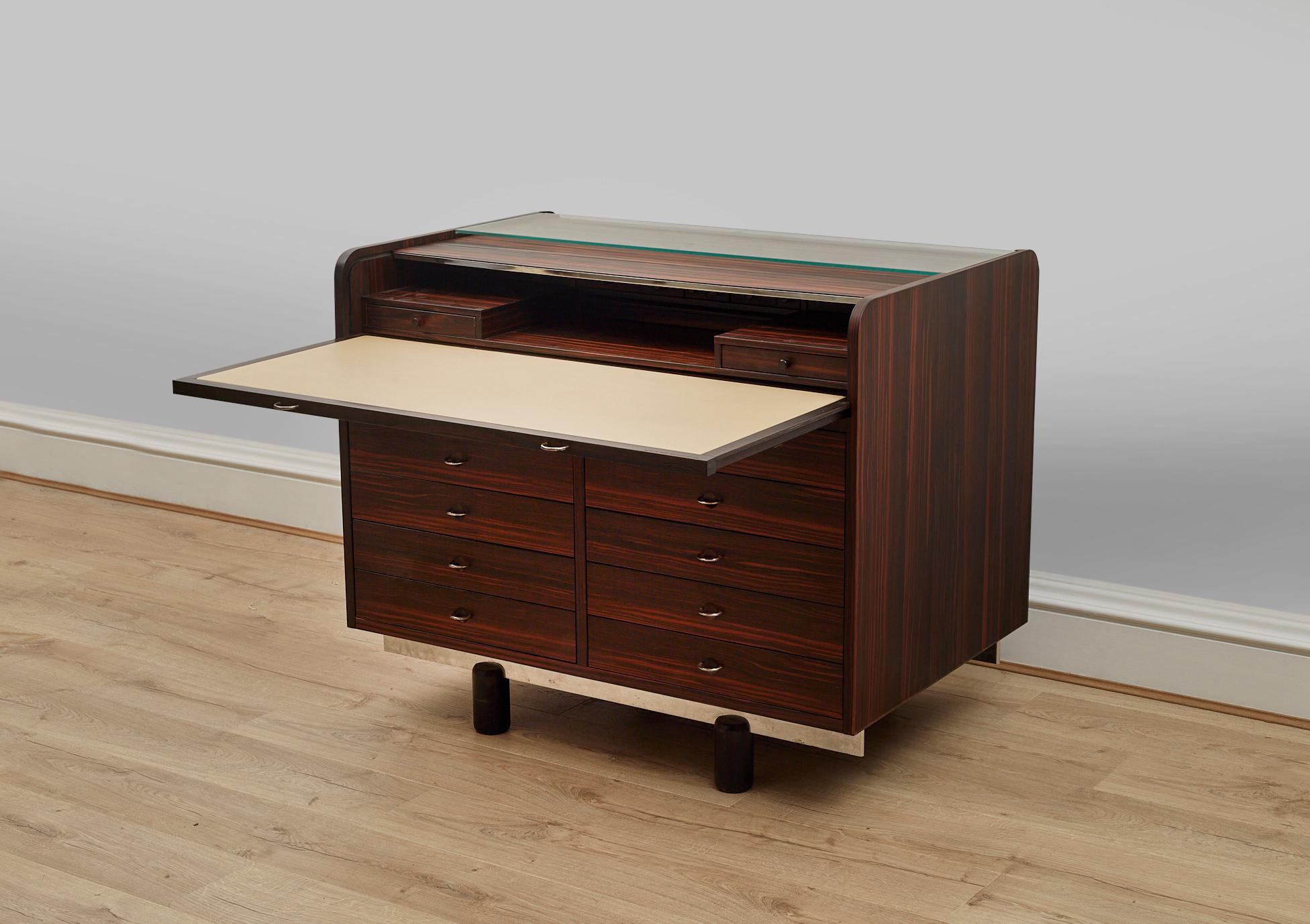 Rosewood Model 804 designed by Gianfranco Frattini and manufactured by Bernini, Italy 1960s. 

This desk is also a storage cabinet 

The desk is characterized by an ingenious mechanic pulling mechanism; if the desk plate is pulled out, the roll-top