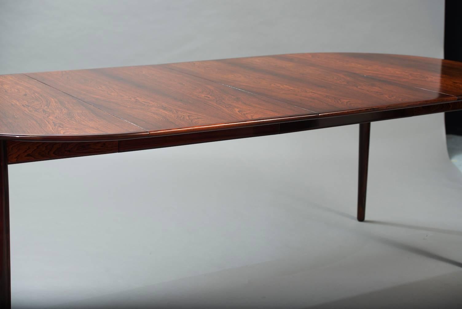 Rosewood round extendable dining table.