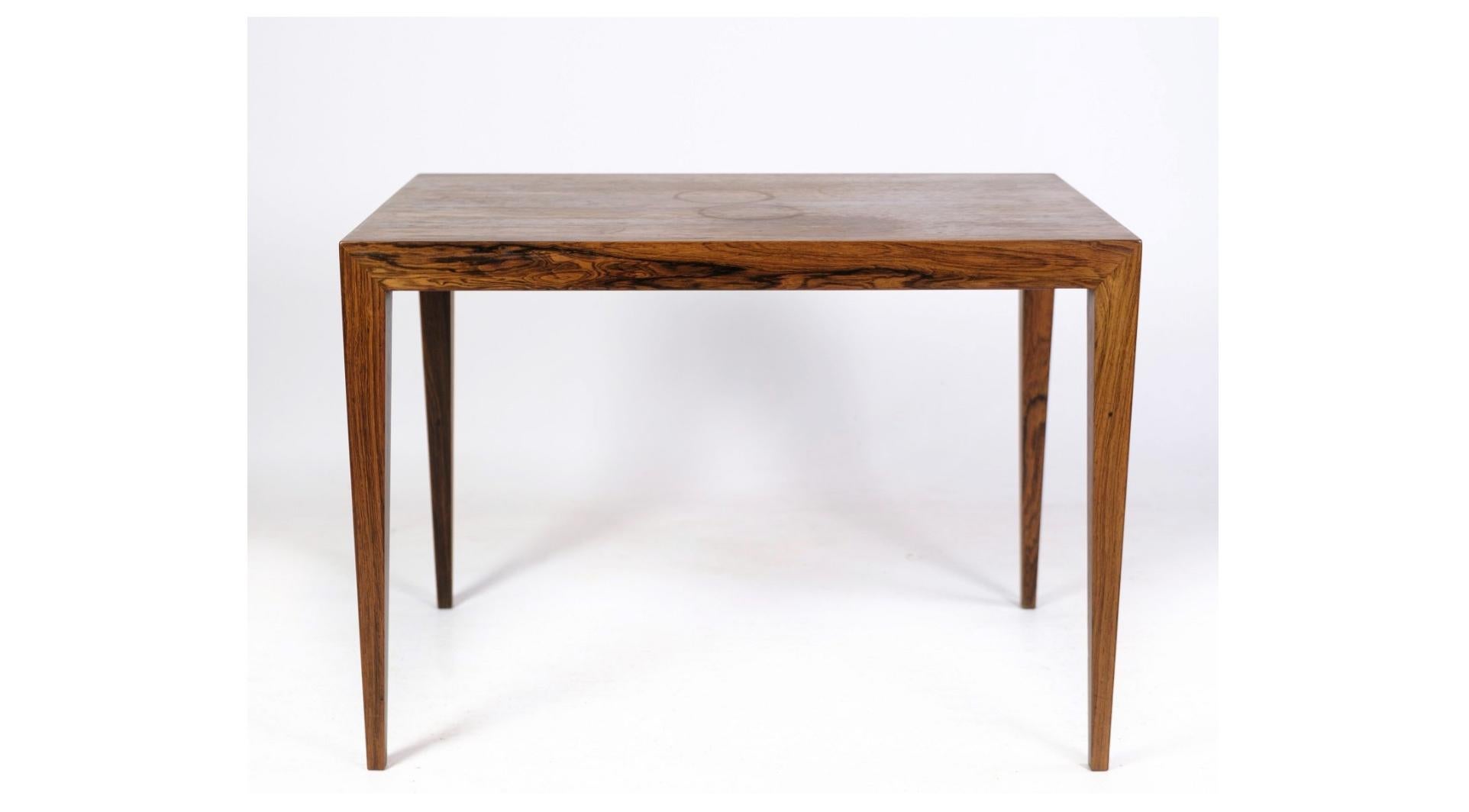 A rosewood side table designed by Severin Hansen and crafted by the esteemed Haslev Furniture Factory in the 1960s. This elegant piece exudes the timeless charm and exceptional craftsmanship characteristic of Danish mid-century design.

Crafted from