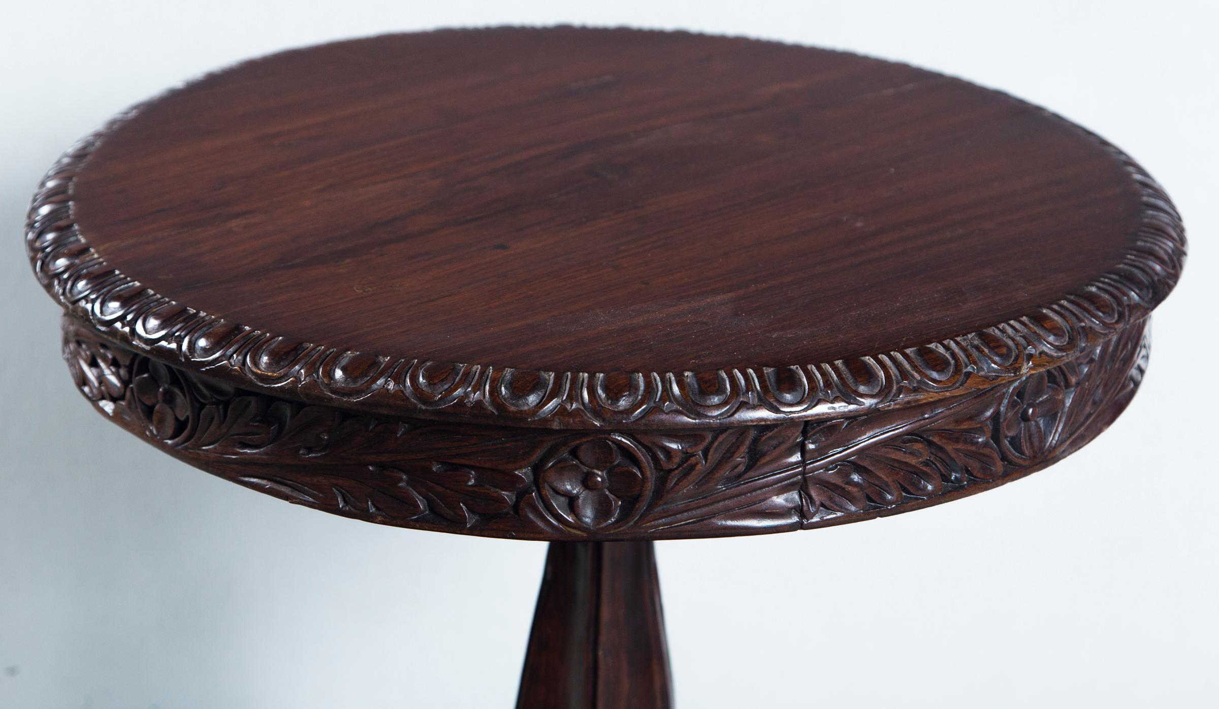 Anglo-Indian carved rosewood circular side table, India circa 1830.
  
