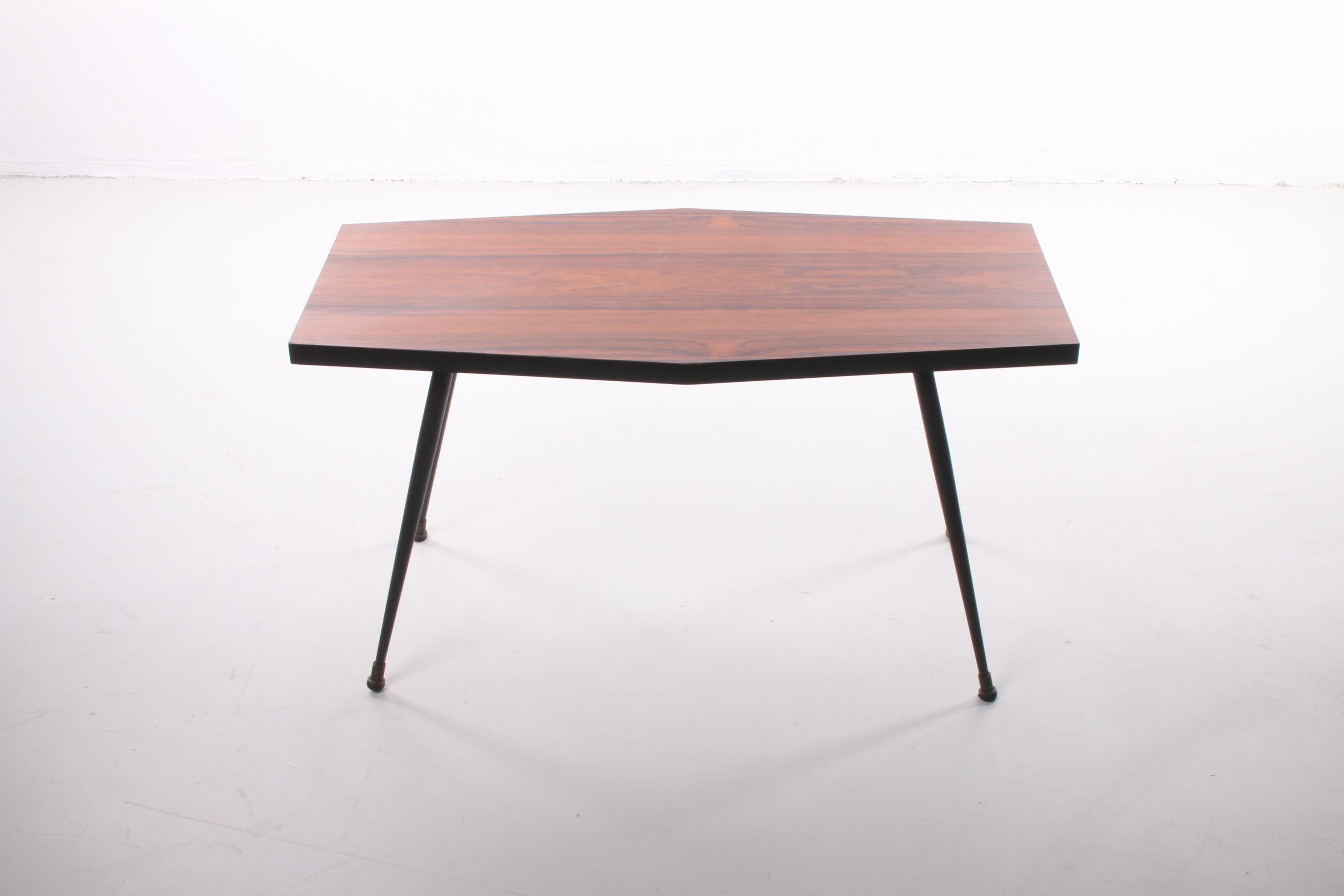 A beautiful table that can either be used as a plant table or side table from the 1970s.

Made of  veneered wood with very elegant metal black legs. The wood gives the table top a beautiful warm color.

The table comes from Germany and is still in