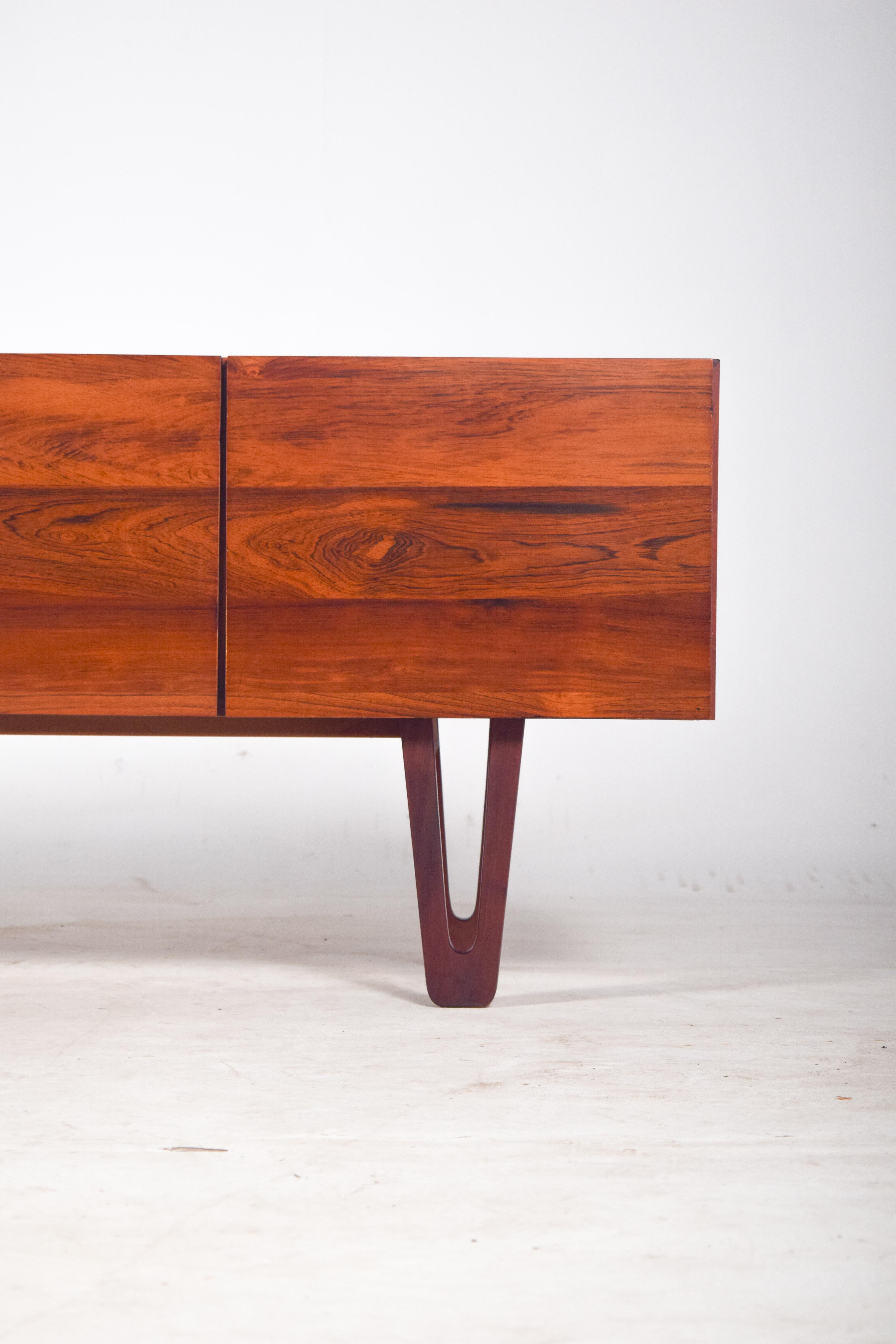 This exquisite rosewood sideboard, crafted by Dustwood Portugal in 2025, is a limited edition piece, part of an exclusive series of only seven. Designed with a keen eye for detail, the sideboard features stunning rosewood veneer, accentuating the