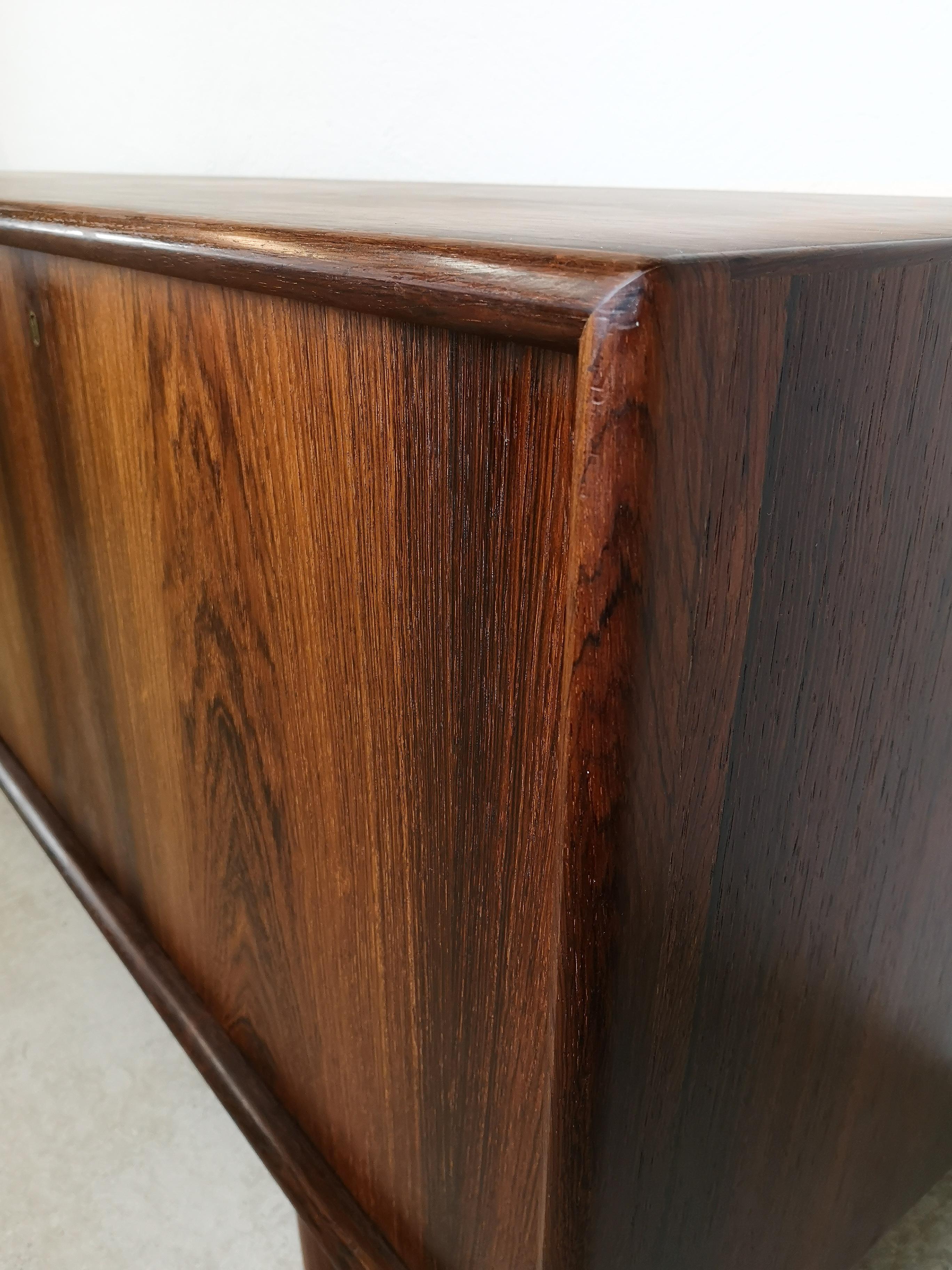 Sideboard in rosewood by Norwegian designer Torbjørn Afdal by Nejestranda Møbelfabrik for Bruksbo.
This sideboard is a very high-quality piece with lovely crafts details with curved short ends on the doors and brass key holes.
It’s not often to be