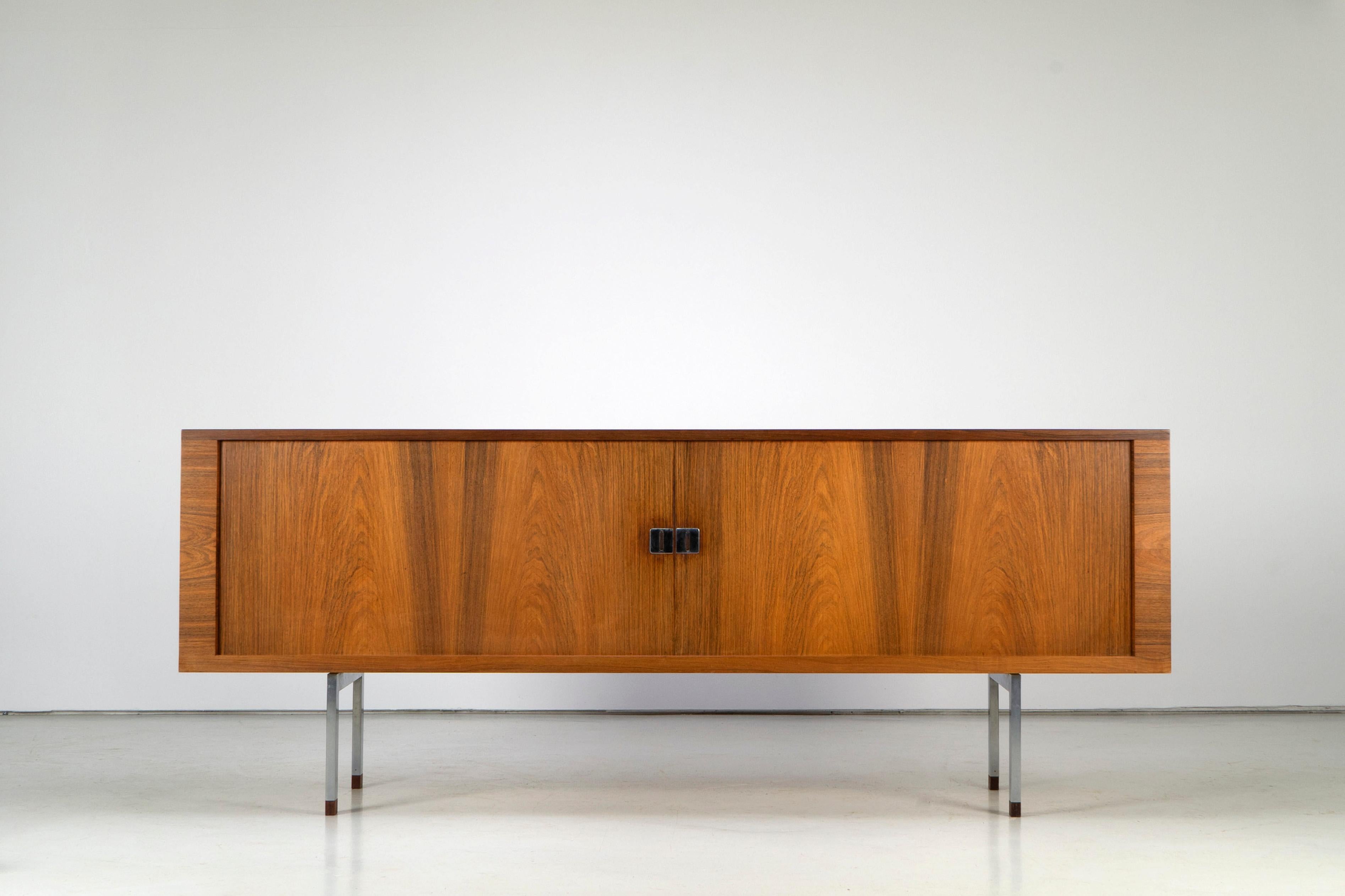 Wonderfully crafted sideboard by Hans Wegner. Veneered with rosewood on the outside and oak on the inside. Excellent workmanship, which is just evident on the tambour doors. The sideboard is marked on the back, as usual with RY Møbler, with the date