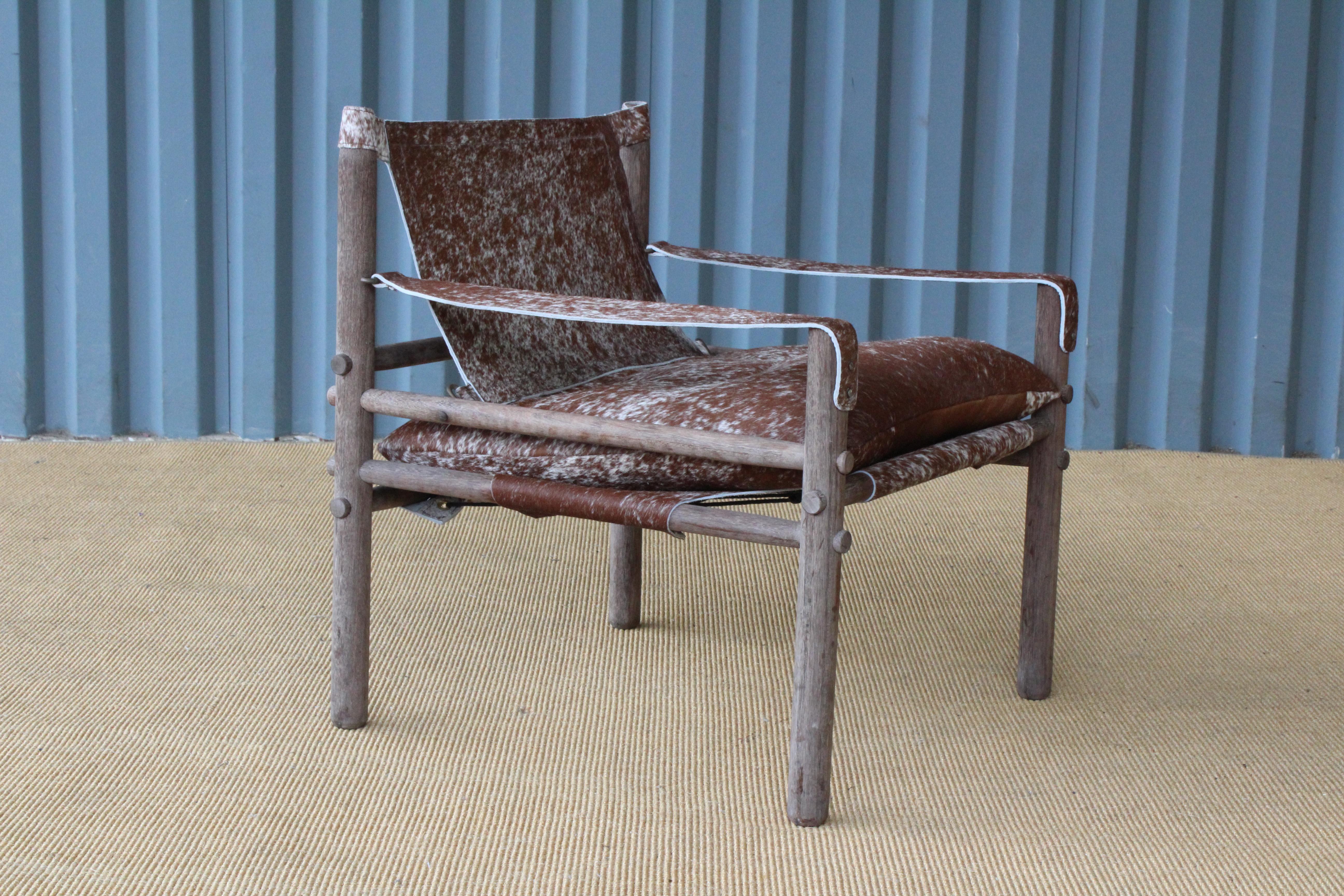 Rosewood safari 'Sirocco' chair designed by Arne Norell and made in Sweden, circa 1960s. Features new cowhide slings. Original patina on the rosewood frame.