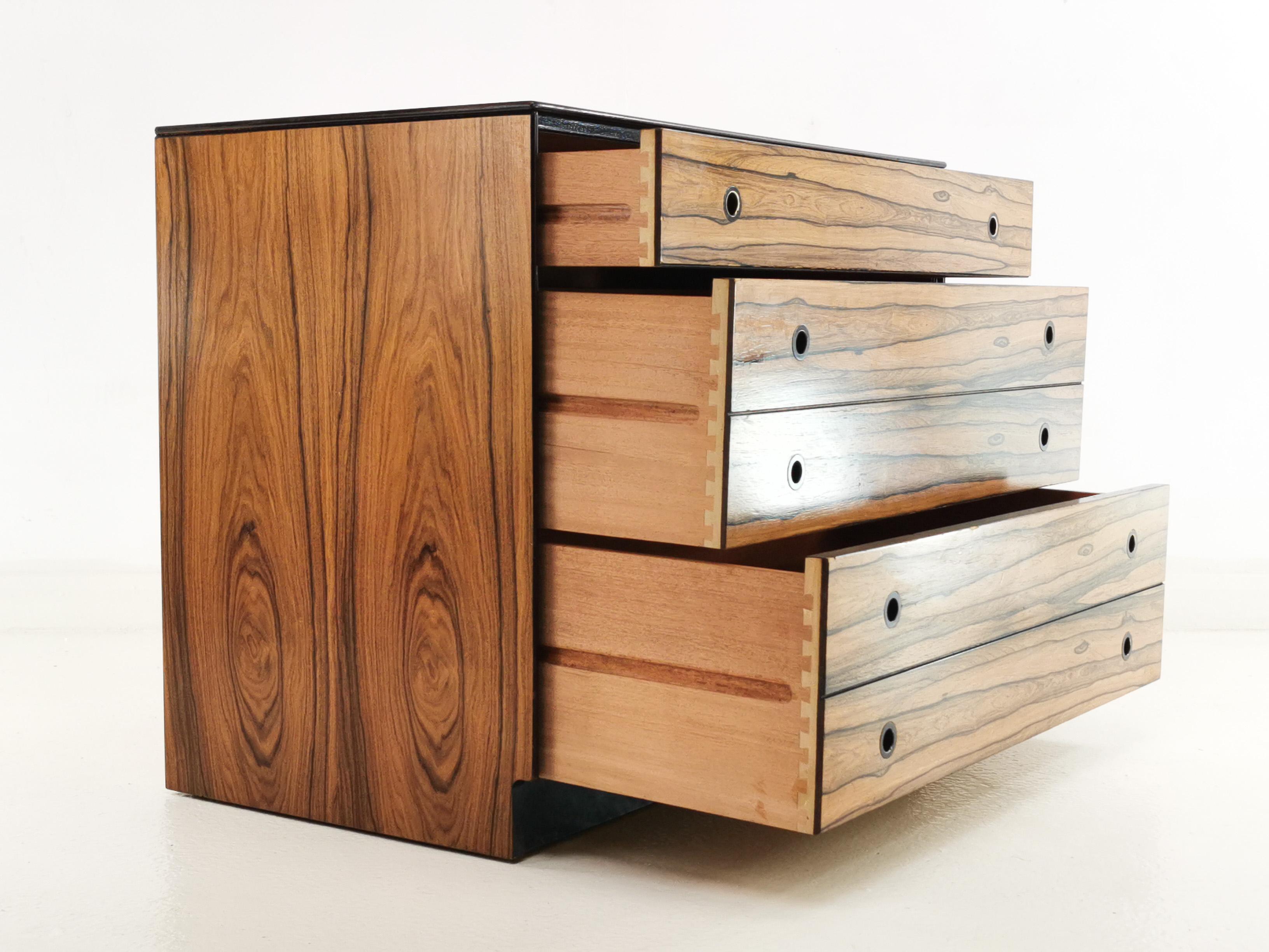 Staples chest of drawers

Offered for sale a rare chest of drawers by Staples & Co from the prestigious Deauville Range, circa 1960 the chest is made in a rich and detailed grained Rosewood with black trim. The unit has four drawers, and recessed
