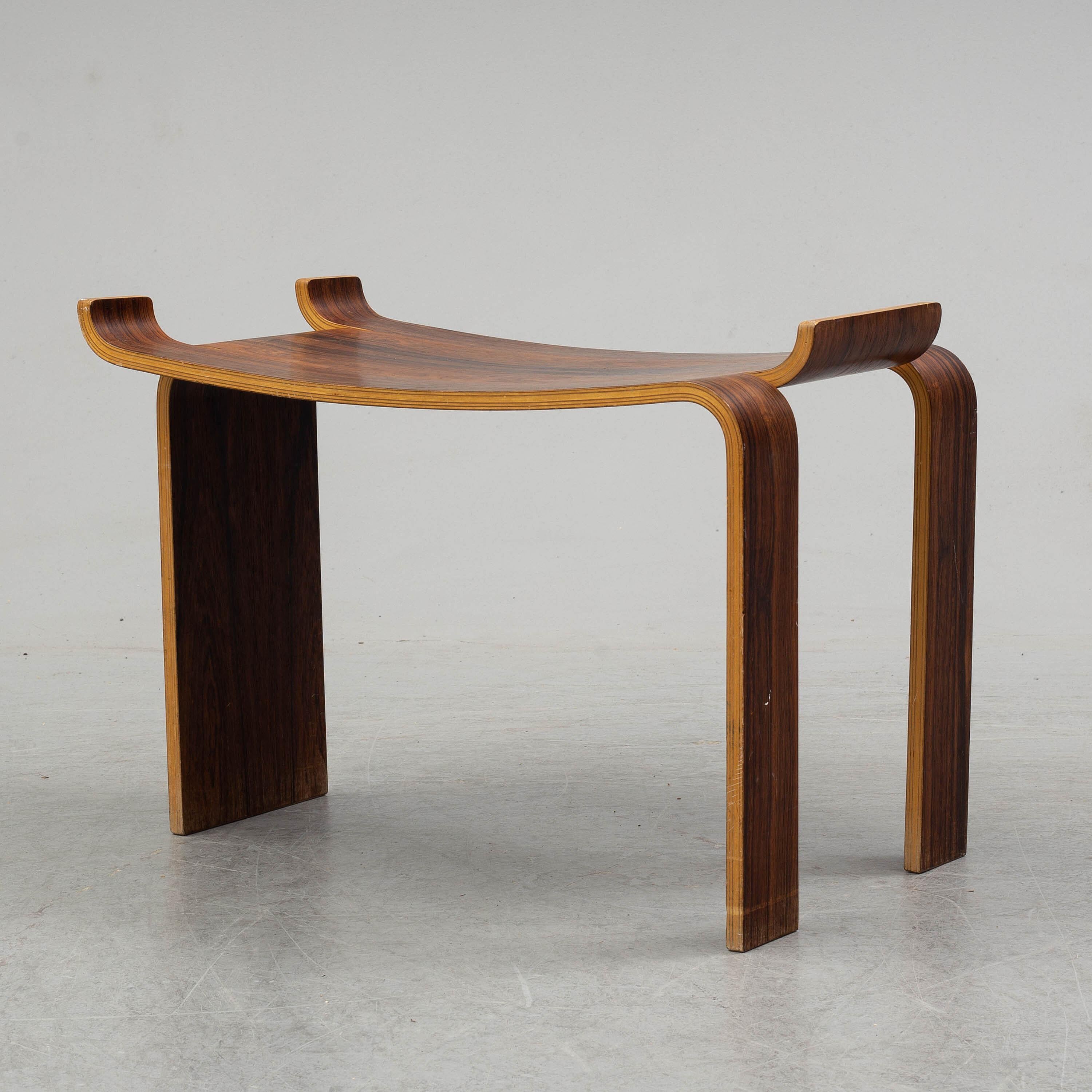 Molded one-piece rosewood stool or side table designed by Kai Lyngfeldt Larsen for Swedish Liljevalchs in 1964.