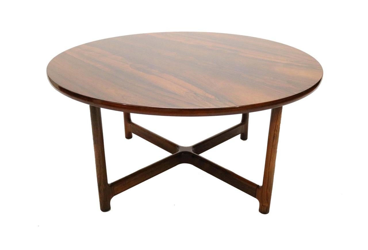A beautiful rosewood coffee table with a high-gloss 