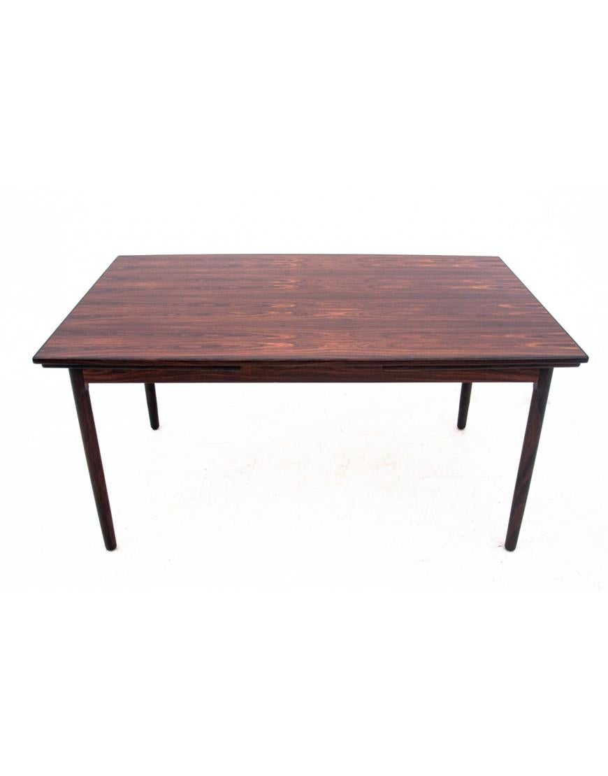 Rosewood table from the 1960s imported from Denmark.

Furniture in very good condition, after professional renovation.

Dimensions: height 74 cm / length 149 - 257 cm / depth 95 cm