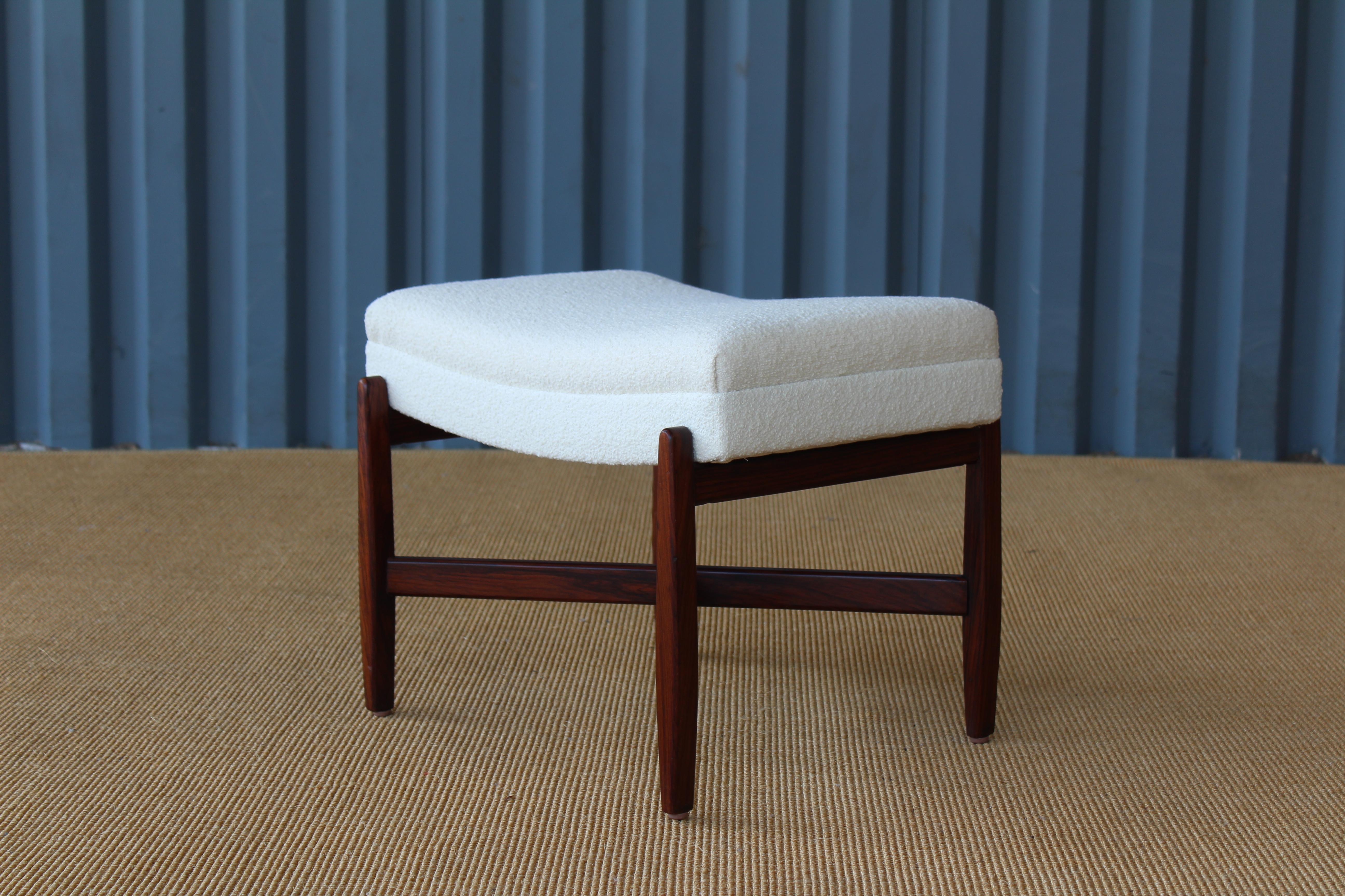 Rosewood footstool with new Knoll bouclé upholstery. Rosewood has been recently refinished.