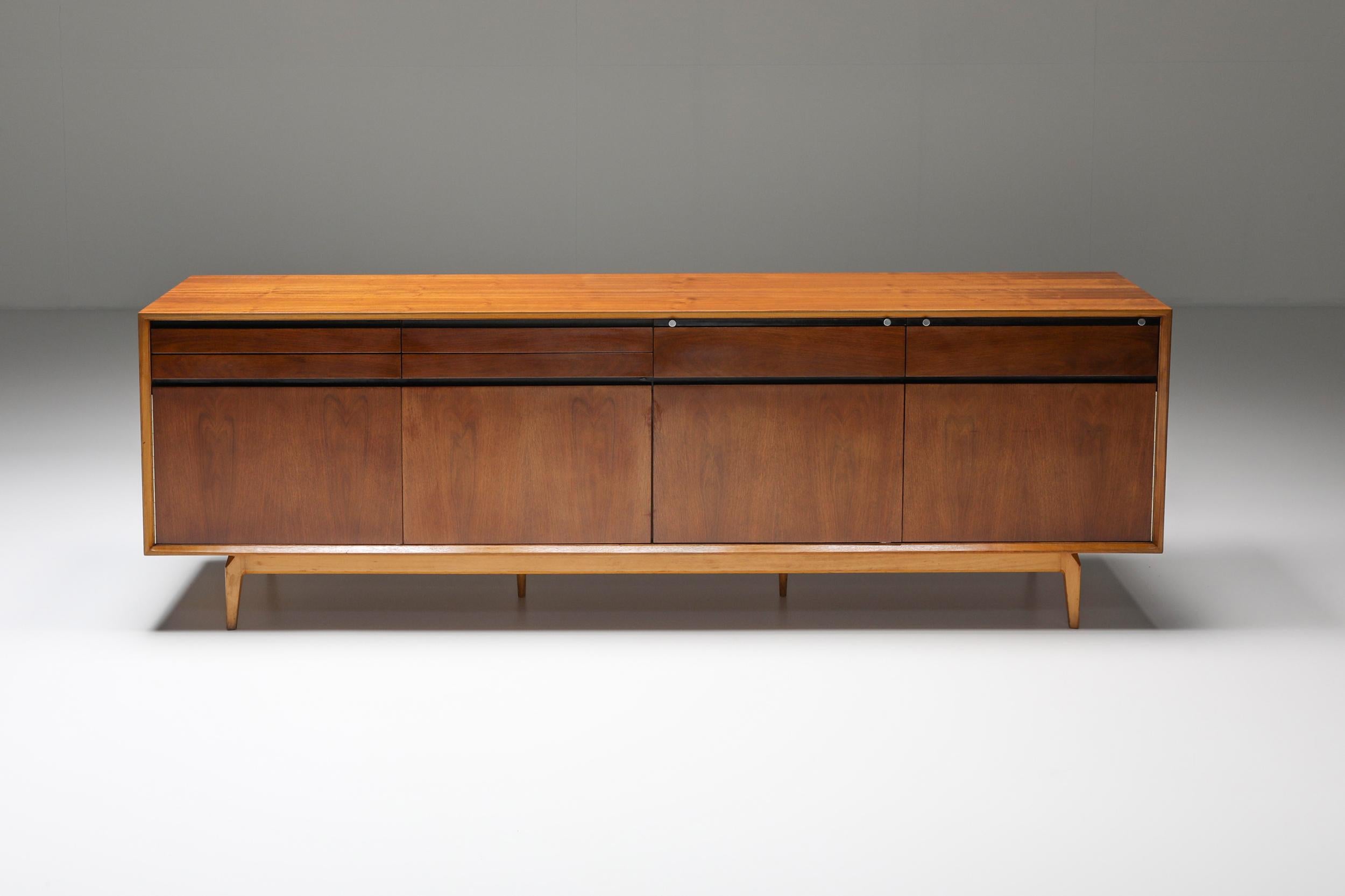 Sideboard, rosewood, and walnut by De Coene, Belgium, 1958.

This sideboard is well-constructed and detailed in a discrete manner. Produced in rosewood and walnut. The piece shows well-designed lines and interesting details, such as the folding