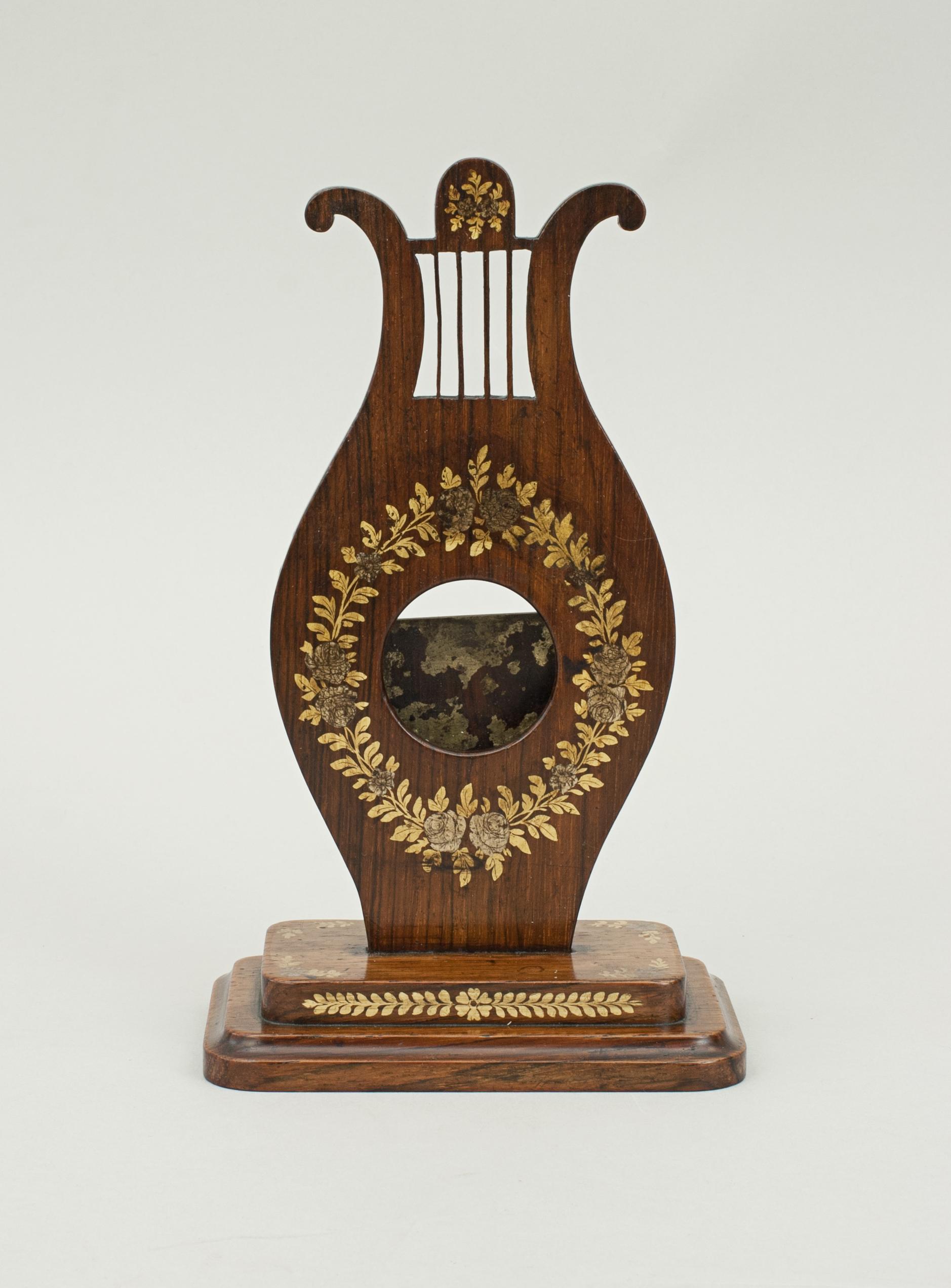 Rosewood watch holder.
Small pocket watch stand with applied decoration. A must have item for those who have a pocket watch. Not only is the pocket watch stand useful, it also makes a great decoration for the bedroom, office or living room.
Will